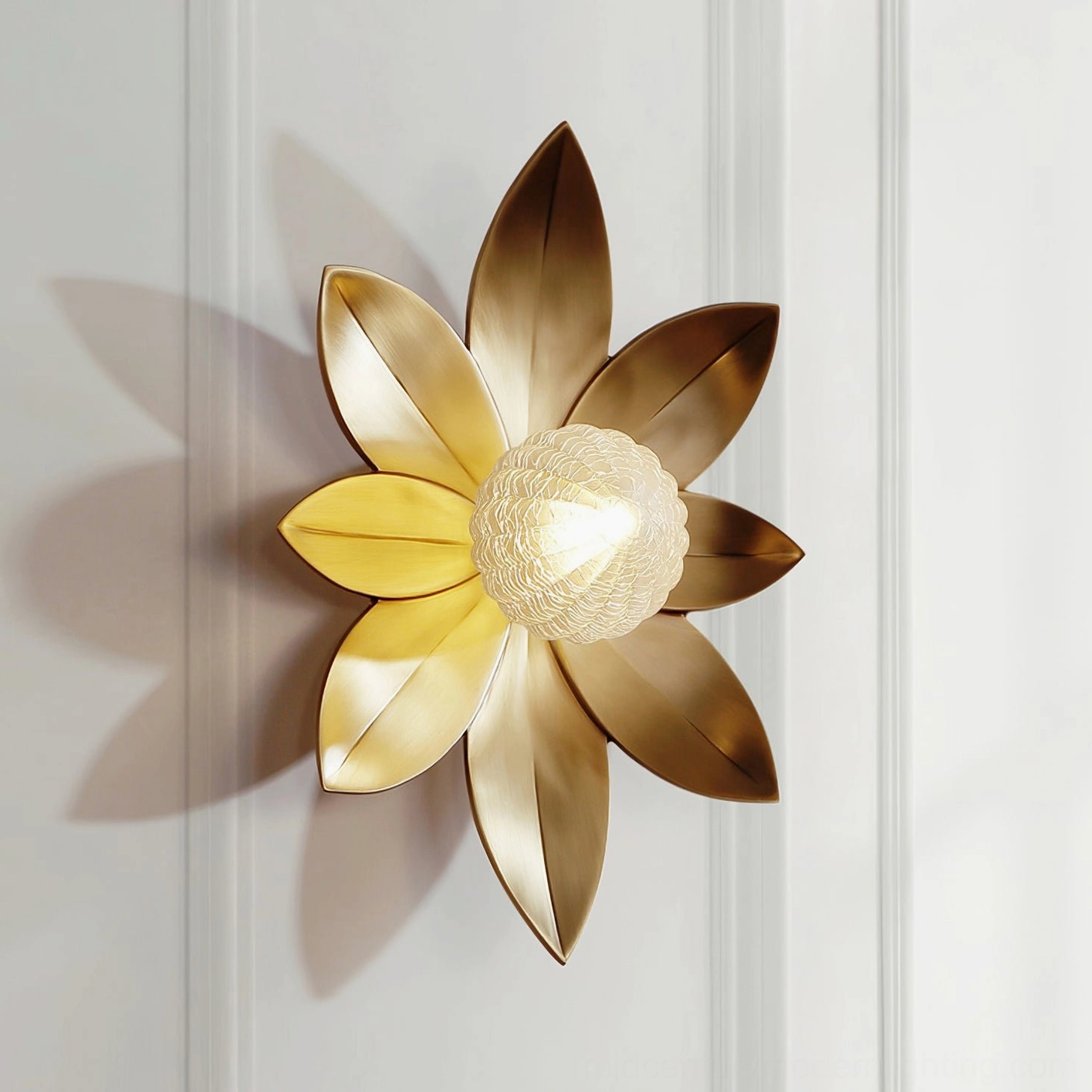 Gigi wall sconce with textured bronze-gold metal petals, close-up product shot