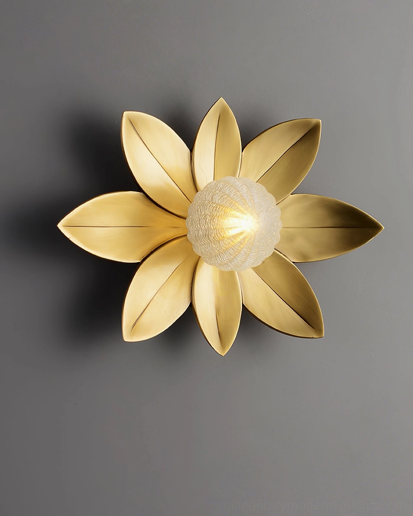 Gigi floral sconce in minimalist white room, silver leaf finish