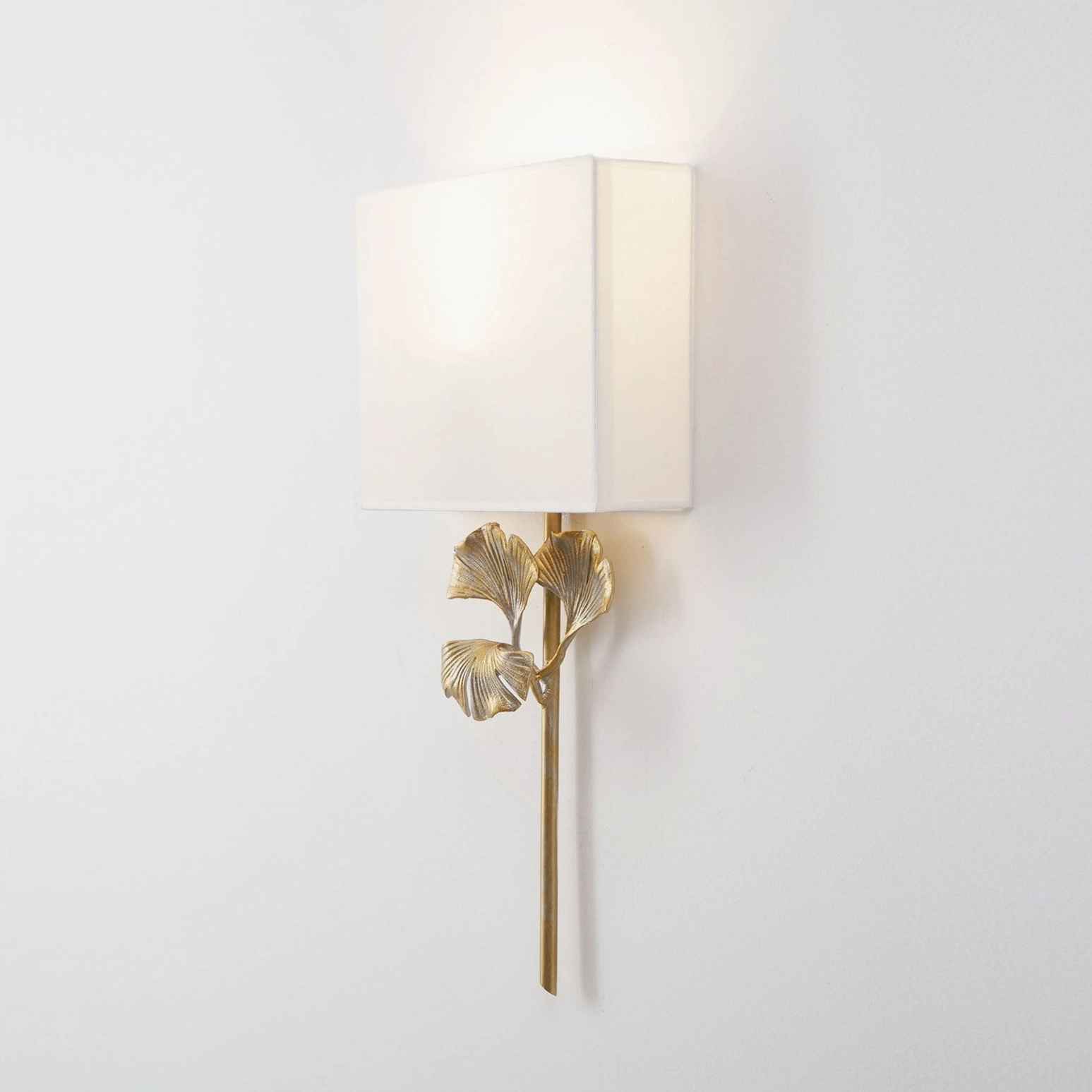 Paired gingko wall lamps with LED bulbs in energy-efficient modern interior design