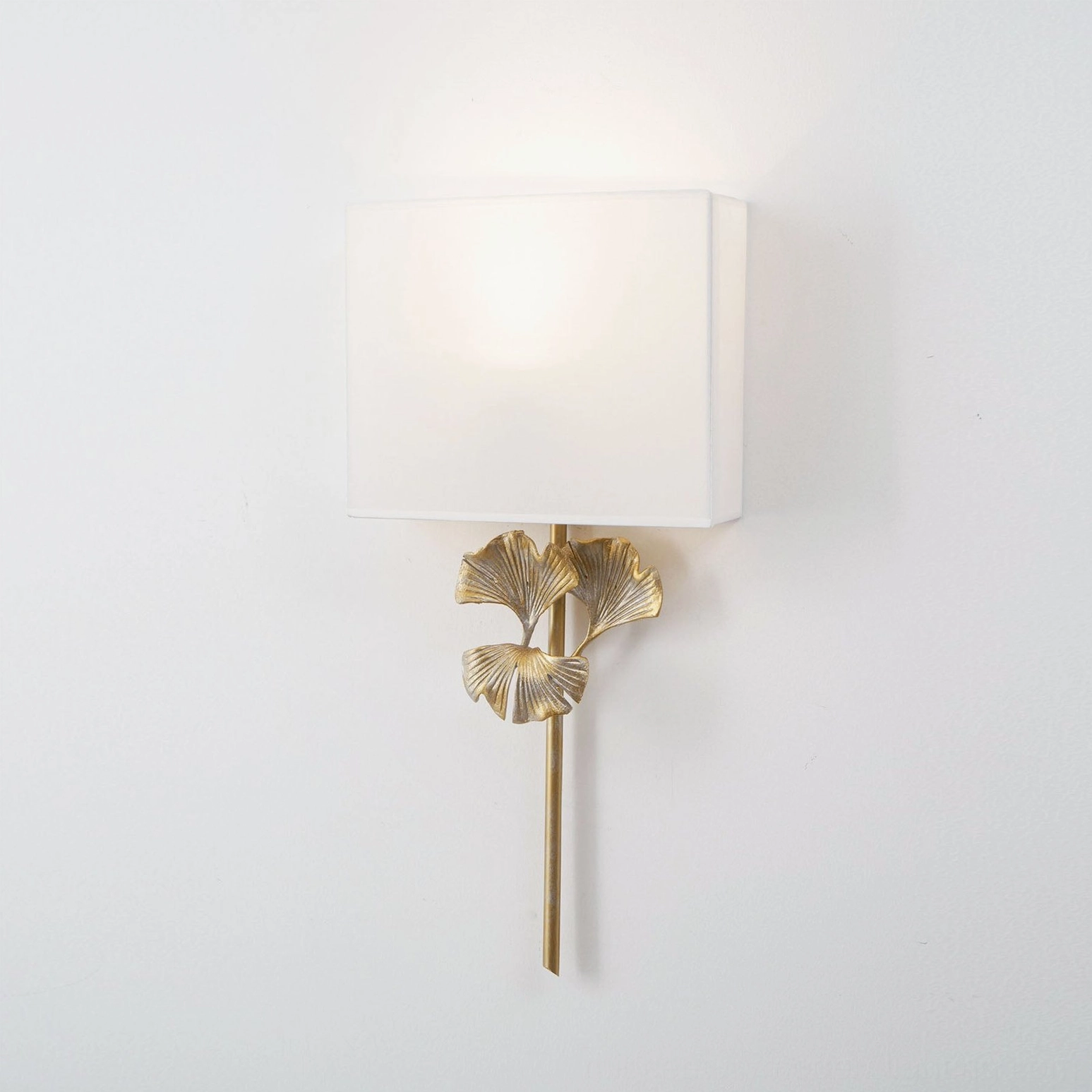 Gingko wall sconce with Edison bulb creating nostalgic vintage ambiance in living room