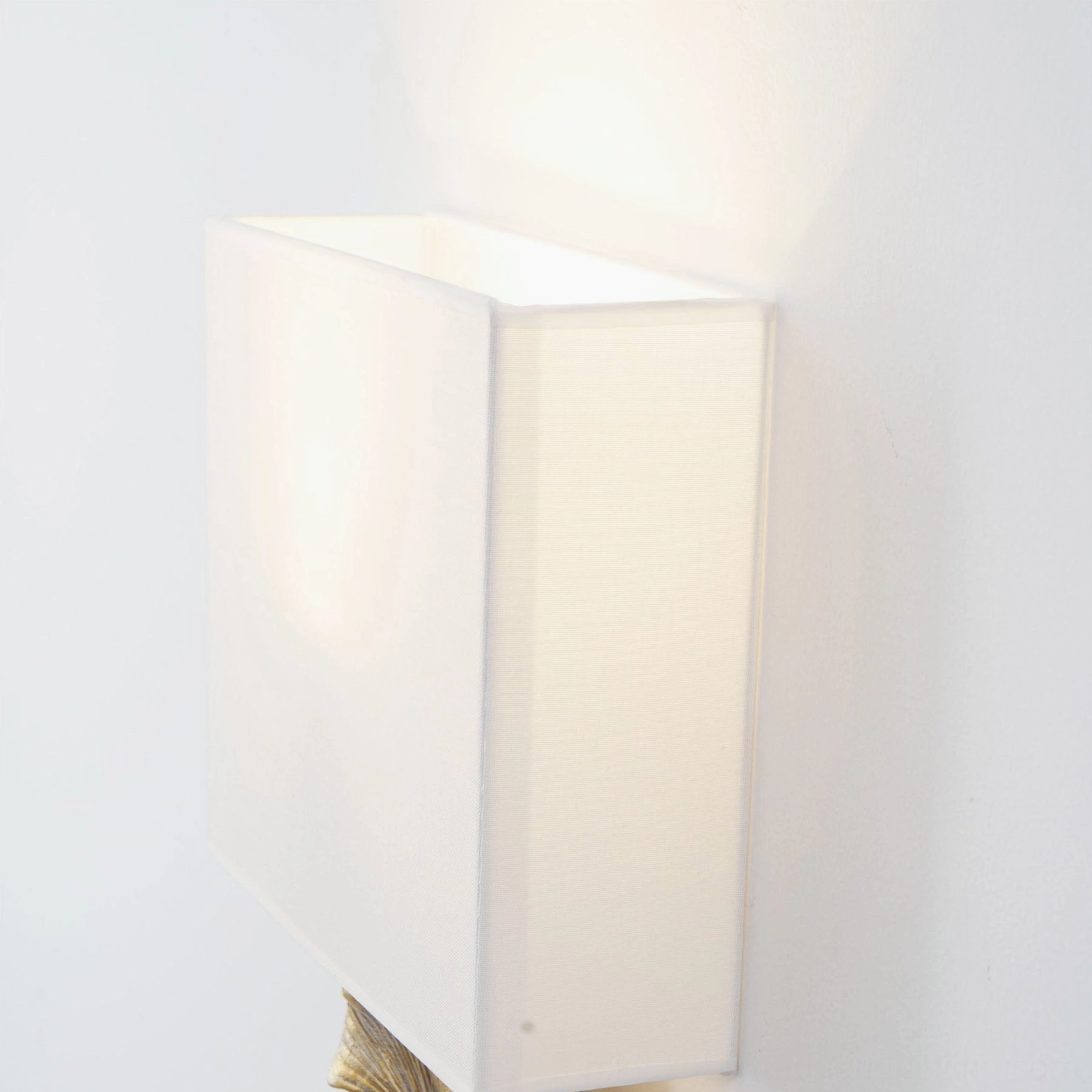 Gingko leaf wall sconce detail showing brass finish options and fabric shade texture