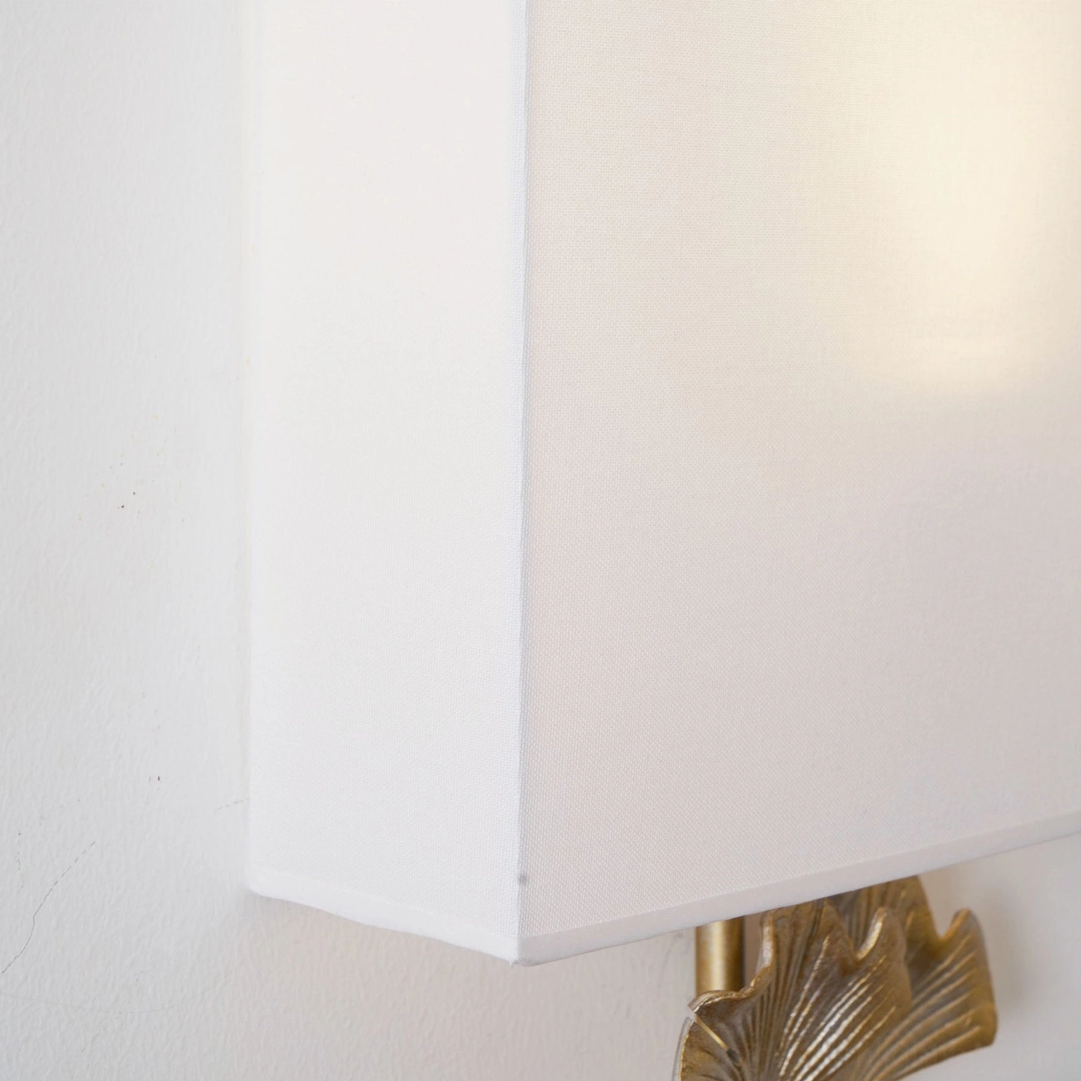 Gingko botanical wall lamp creating layered lighting in eclectic interior design space