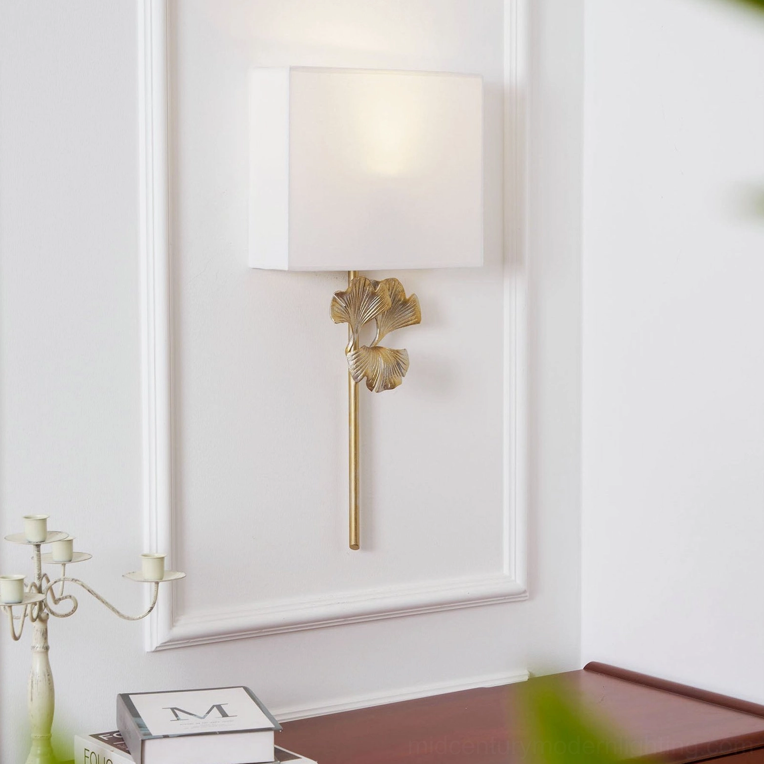 Antique brass gingko leaf wall sconce architectural lighting detail shot