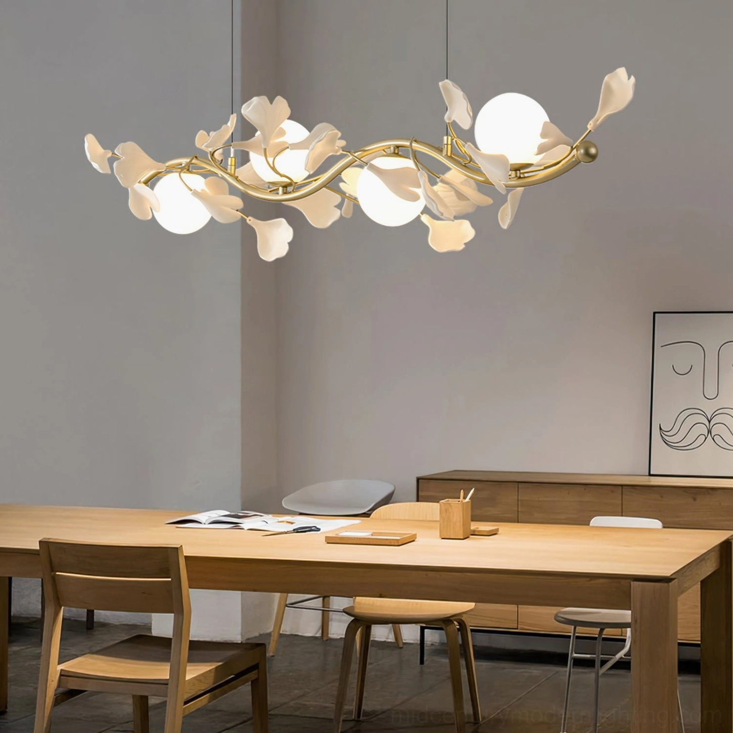 Modern dining room with Ginkgo Glass Chandelier 4-head linear fixture showing warm gold brass finish and white ceramic sockets