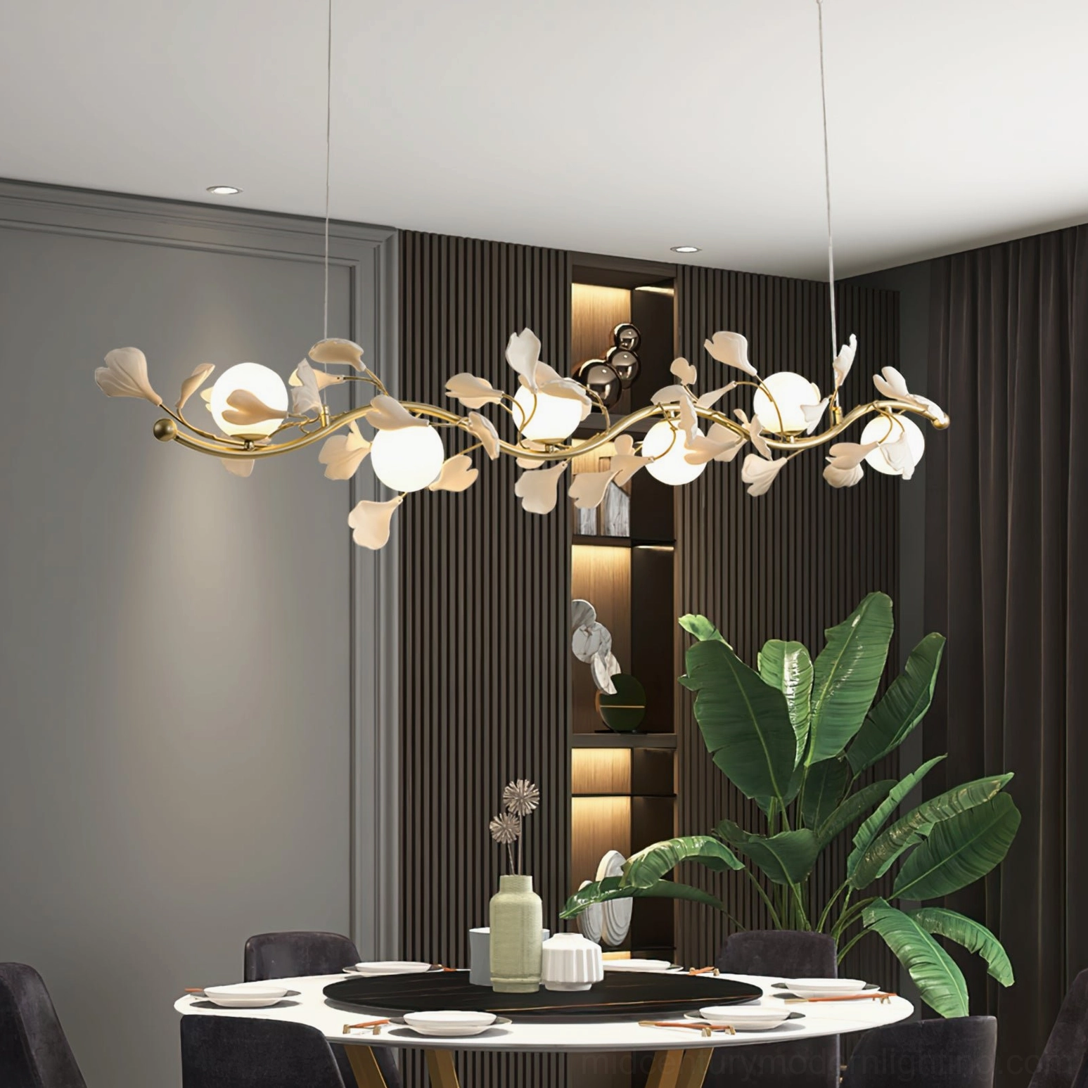 Ginkko Glass Chandelier linear pendant light above round dining table in modern room with built-in shelves