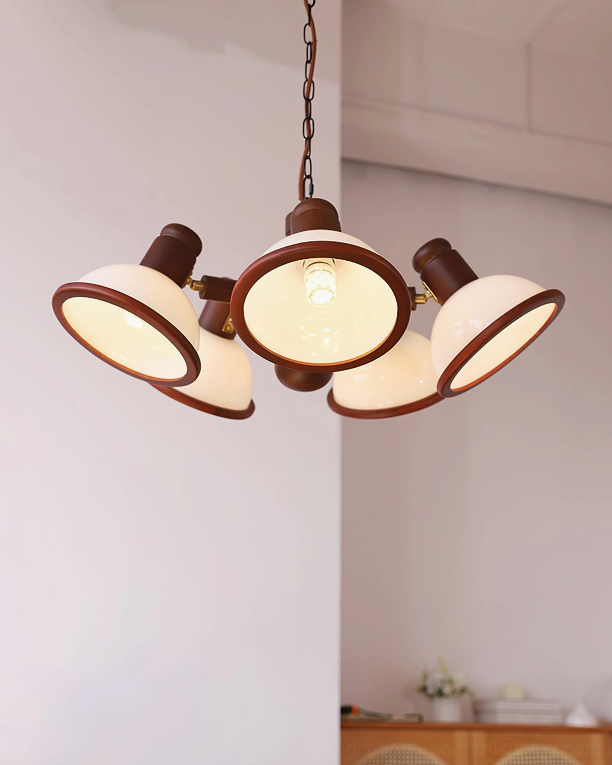 Illuminated Girona Mia 5-head wooden branch chandelier in vintage industrial interior with warm ambient glow