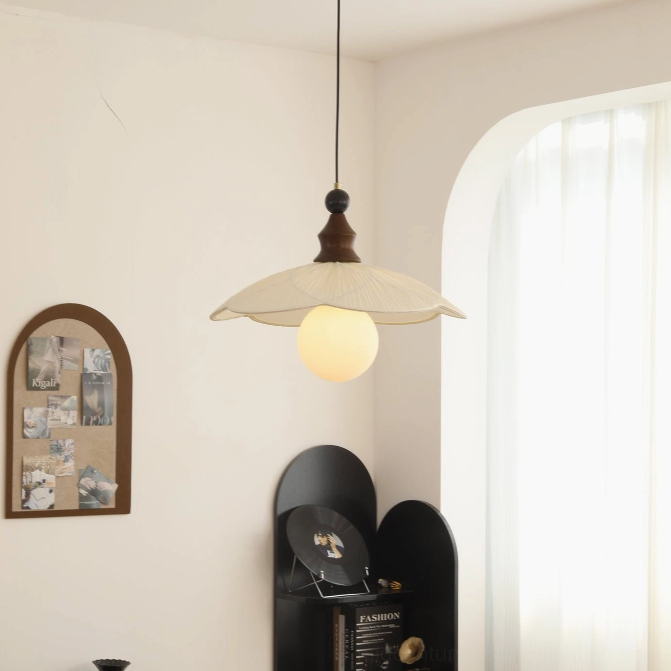 Giselle pendant light in minimalist living room - organic pleated shade illuminating contemporary interior space