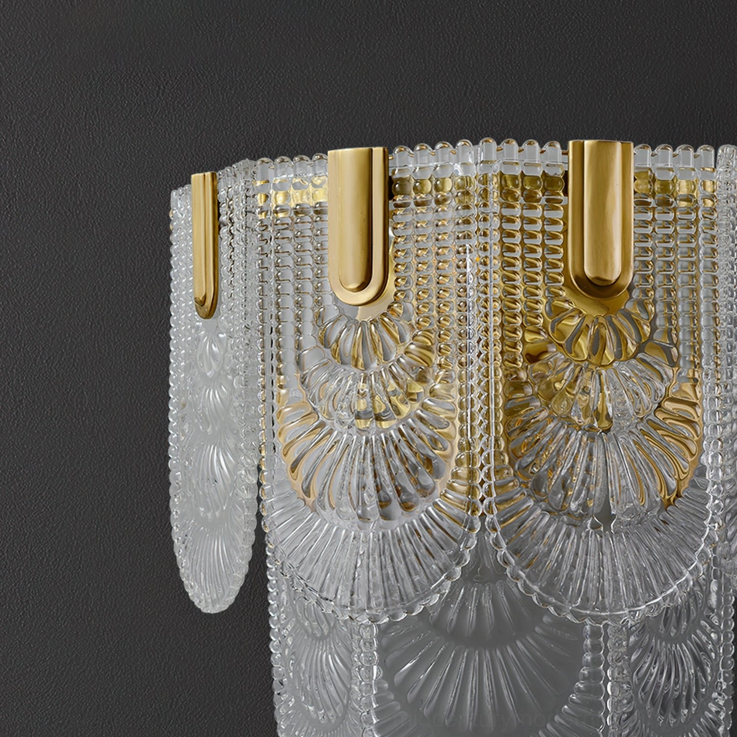 Giulia brass wall lamp providing reading light in contemporary bedroom setting with warm color temperature