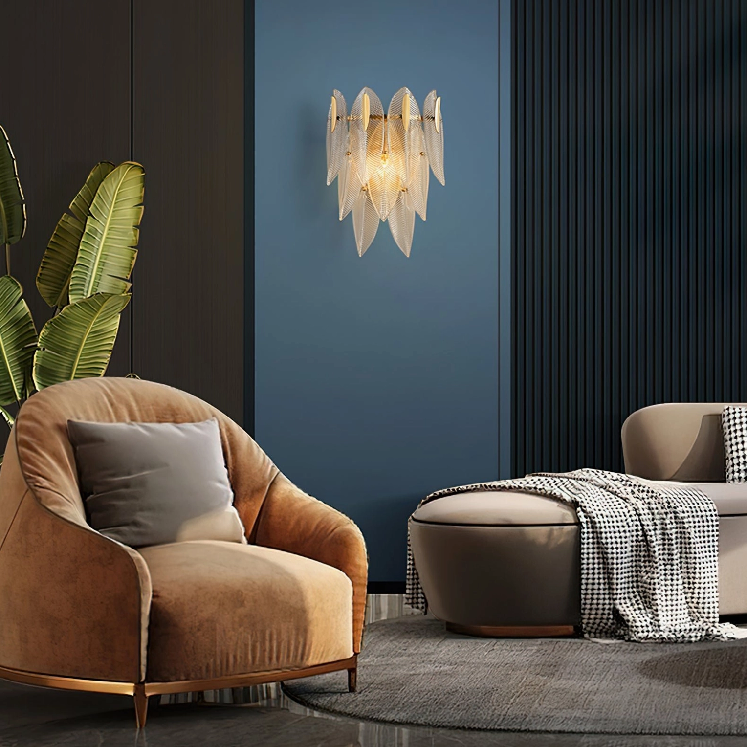 Giulia brass wall lamp illuminated in luxury lounge area showcasing warm glamorous modern lighting