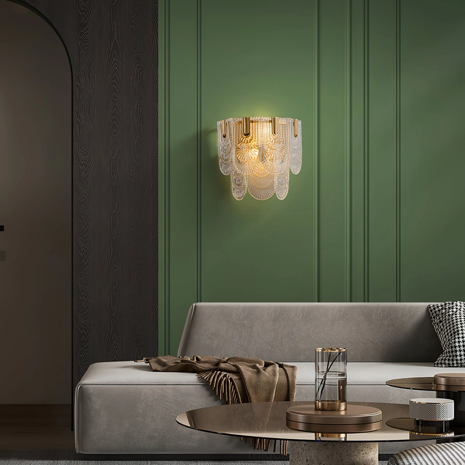Giulia brass wall lamp front view displaying polished brass frame and sculptural glass elements