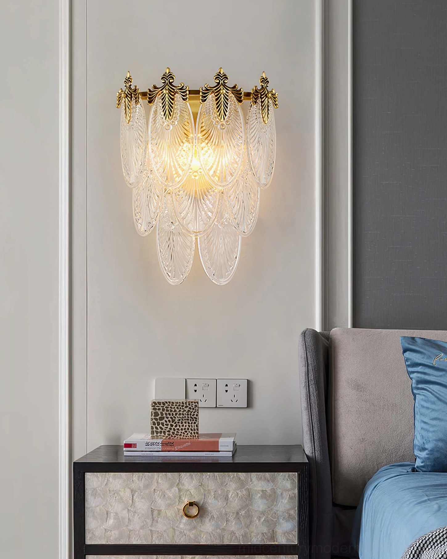 Giulia brass wall lamp with textured glass diffuser in contemporary minimalist interior setting