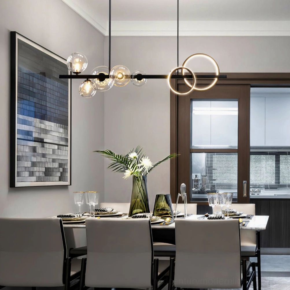 Glass bubble pendant light fixture with black frame and gold ring accents in contemporary minimalist interior space