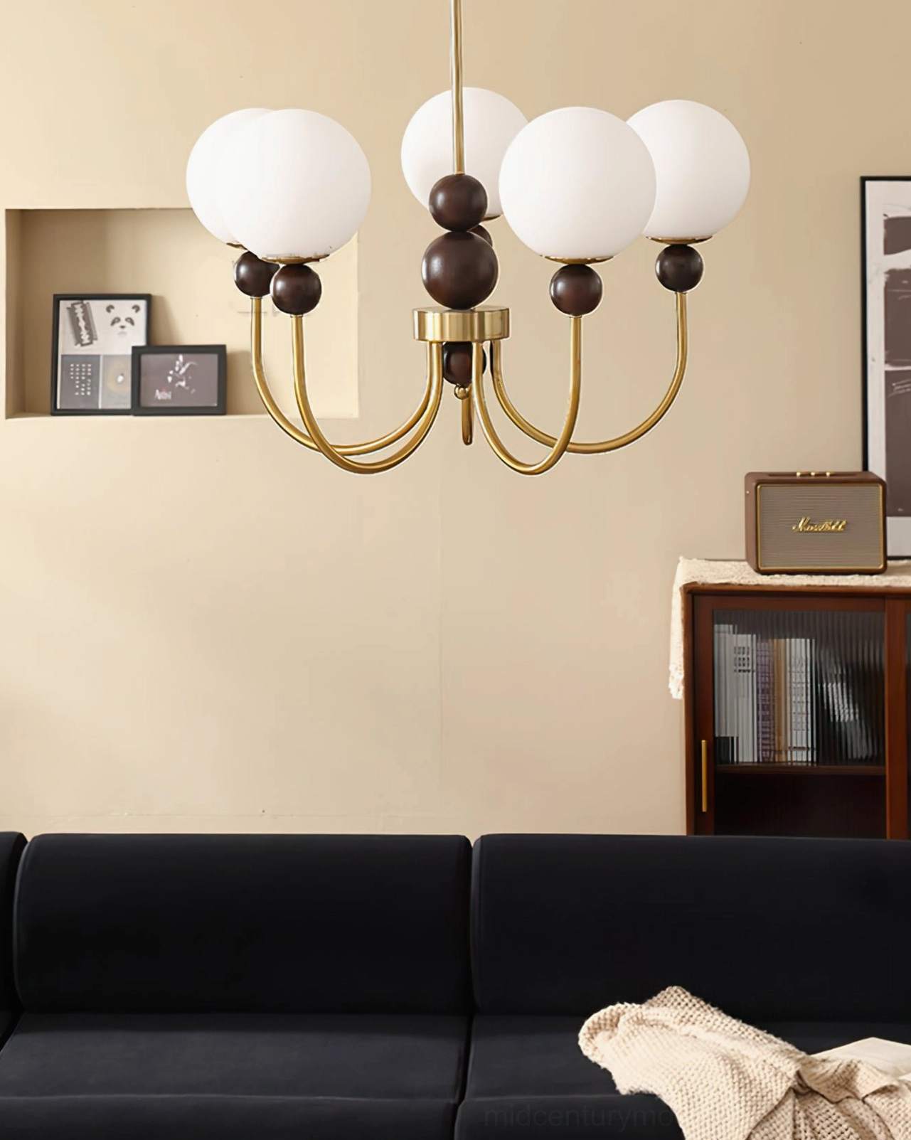 Modern glass pendant chandelier with metal frame and frosted shades, architectural ceiling view