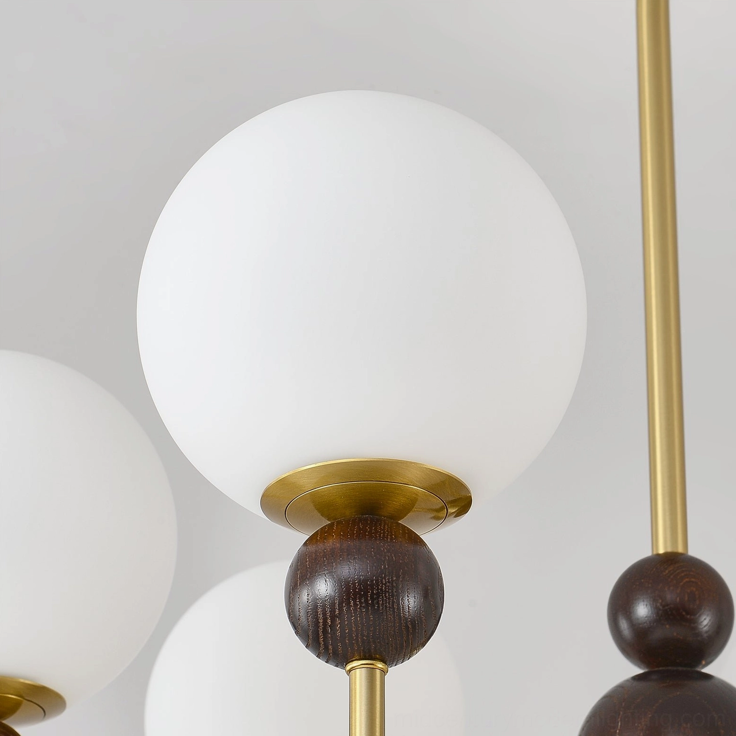 Contemporary glass chandelier showing metal frame construction and glass sphere assembly