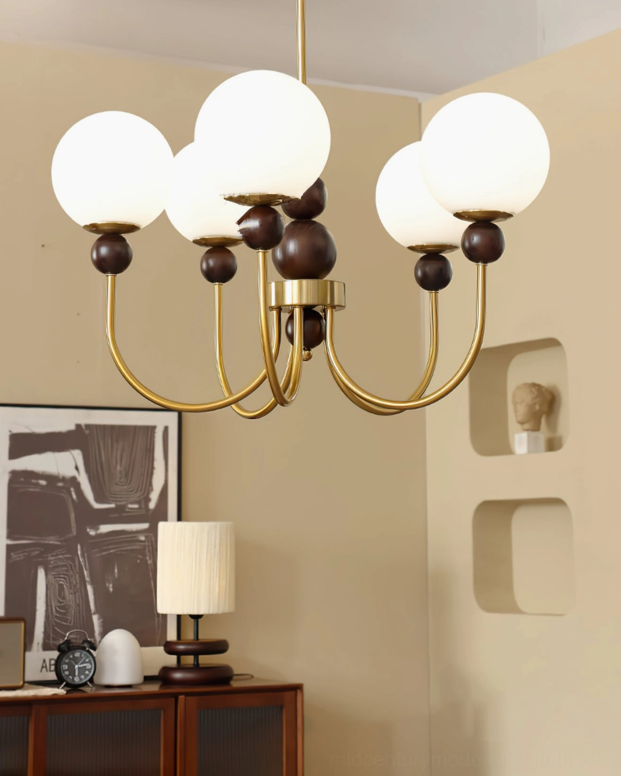 Contemporary glass chandelier with warm ambient lighting, frosted globe shades close-up