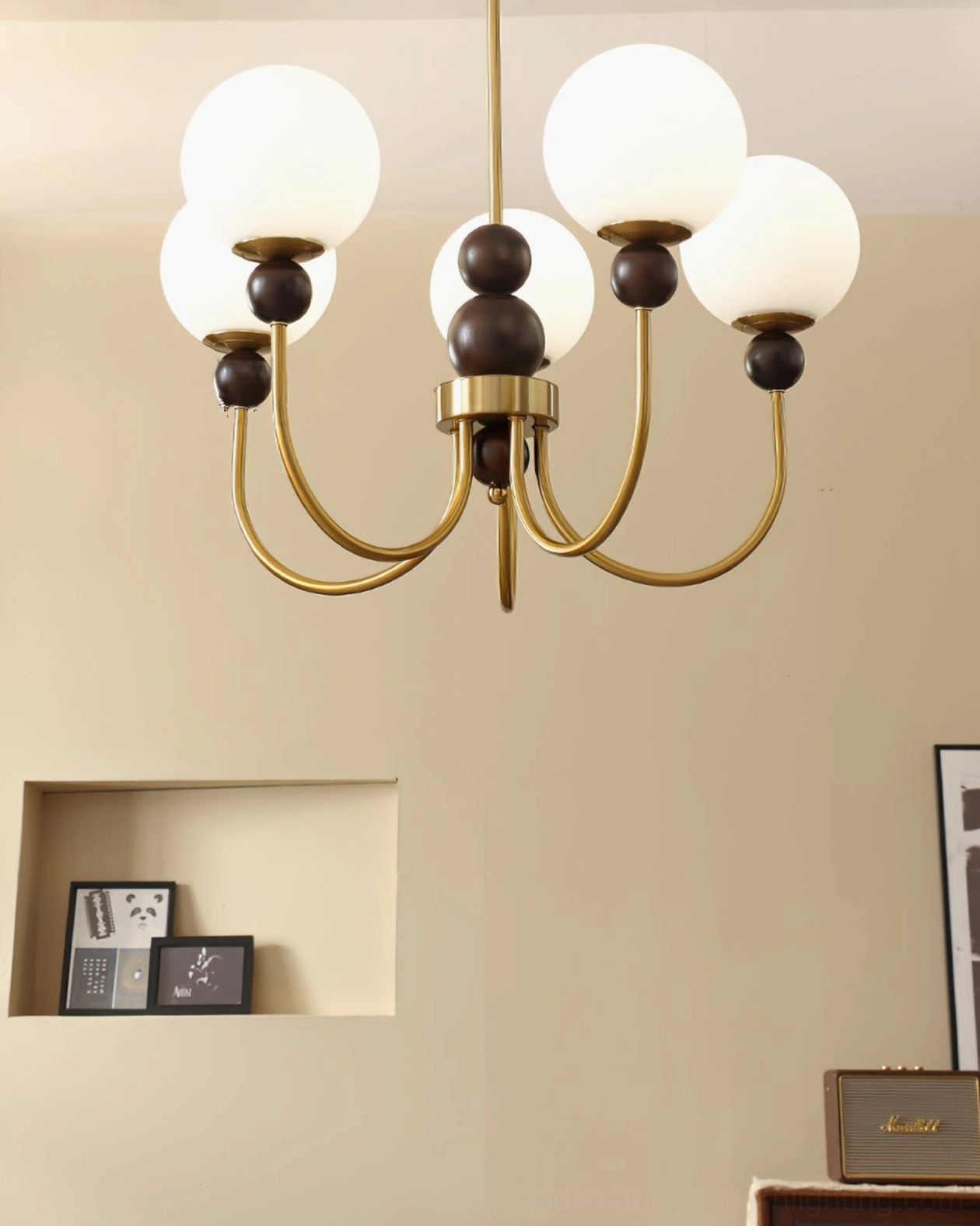Modern glass pendant chandelier showing light distribution through frosted spheres