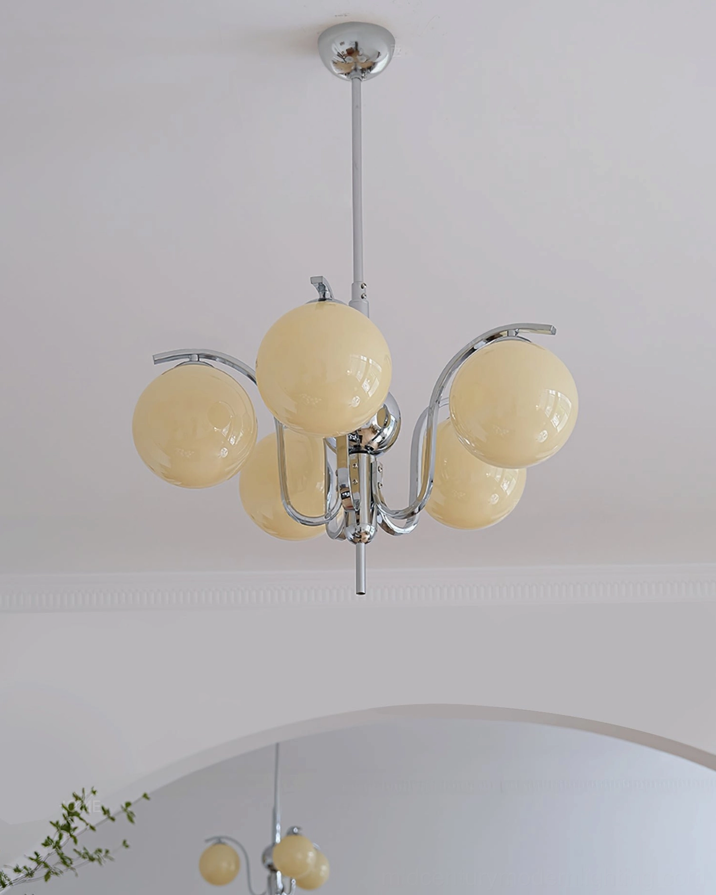 Glass globe chandelier with polished chrome finish showing geometric mid-century modern silhouette