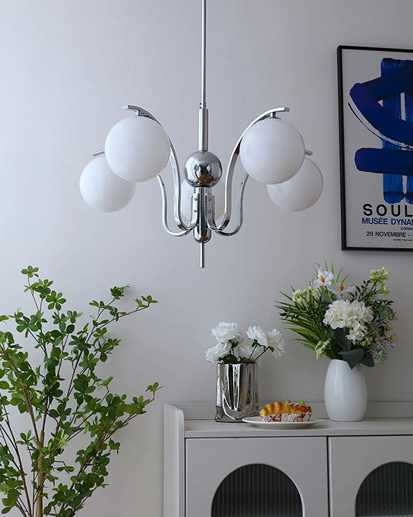 Glass globe chandelier fixture shown in various interior styling contexts and applications