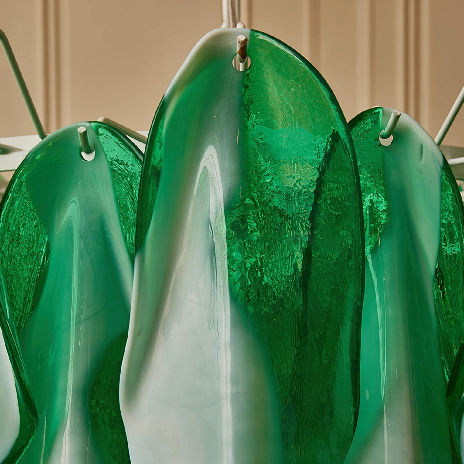 Side close-up of tiered glass petal construction showing drilled mounting points and metal hanging hardware detail