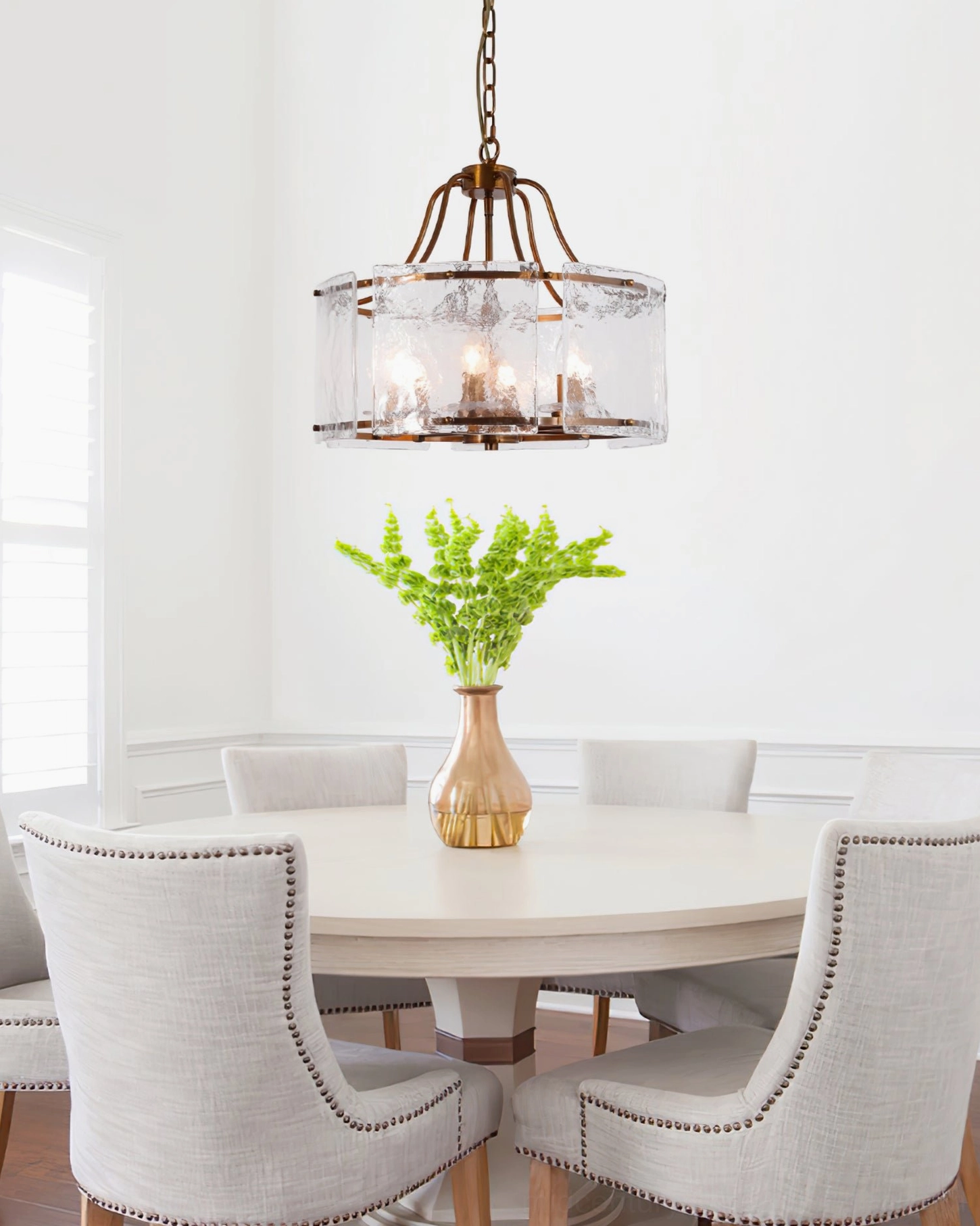 Glenn Round Chandelier in family dining space - vintage brass drum light with tufted dining chairs