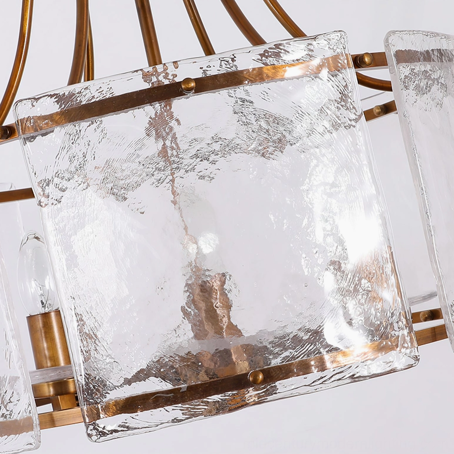 Glenn Round Chandelier close-up detail - water-ripple clear glass panels and brass mounting hardware