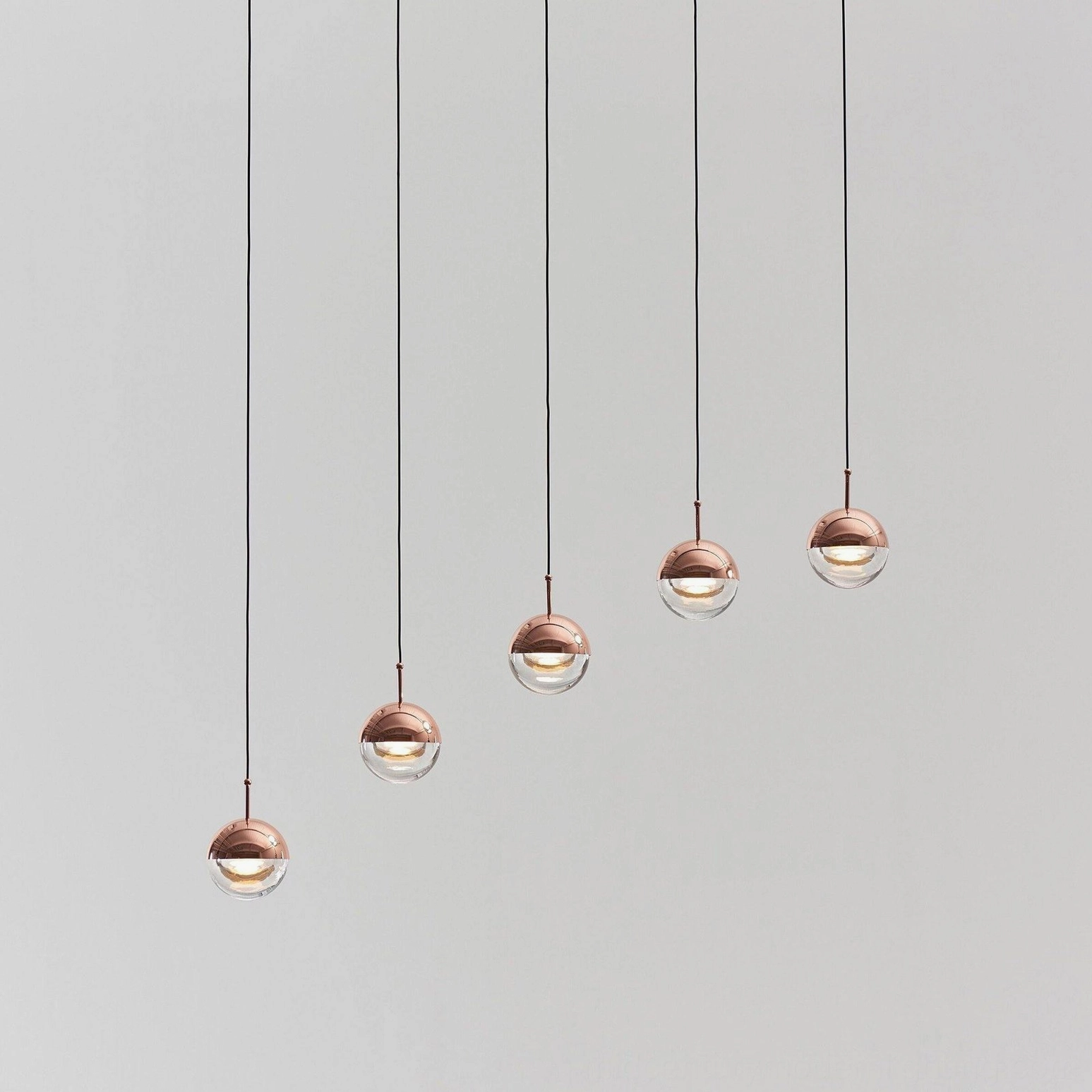Gold finish spherical pendant chandelier modern minimalist lighting room setting display