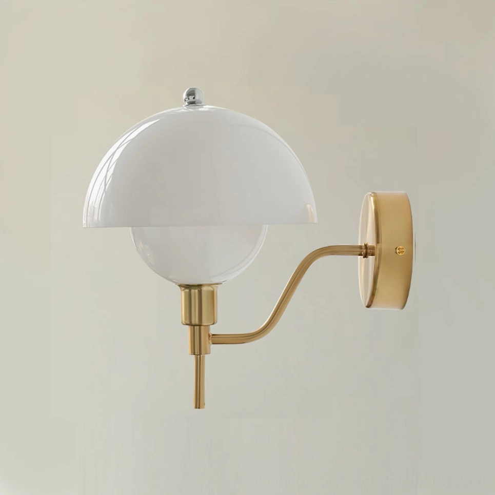 Gold and white anchored orb wall lamp in home display showing warm finish and elegant proportions
