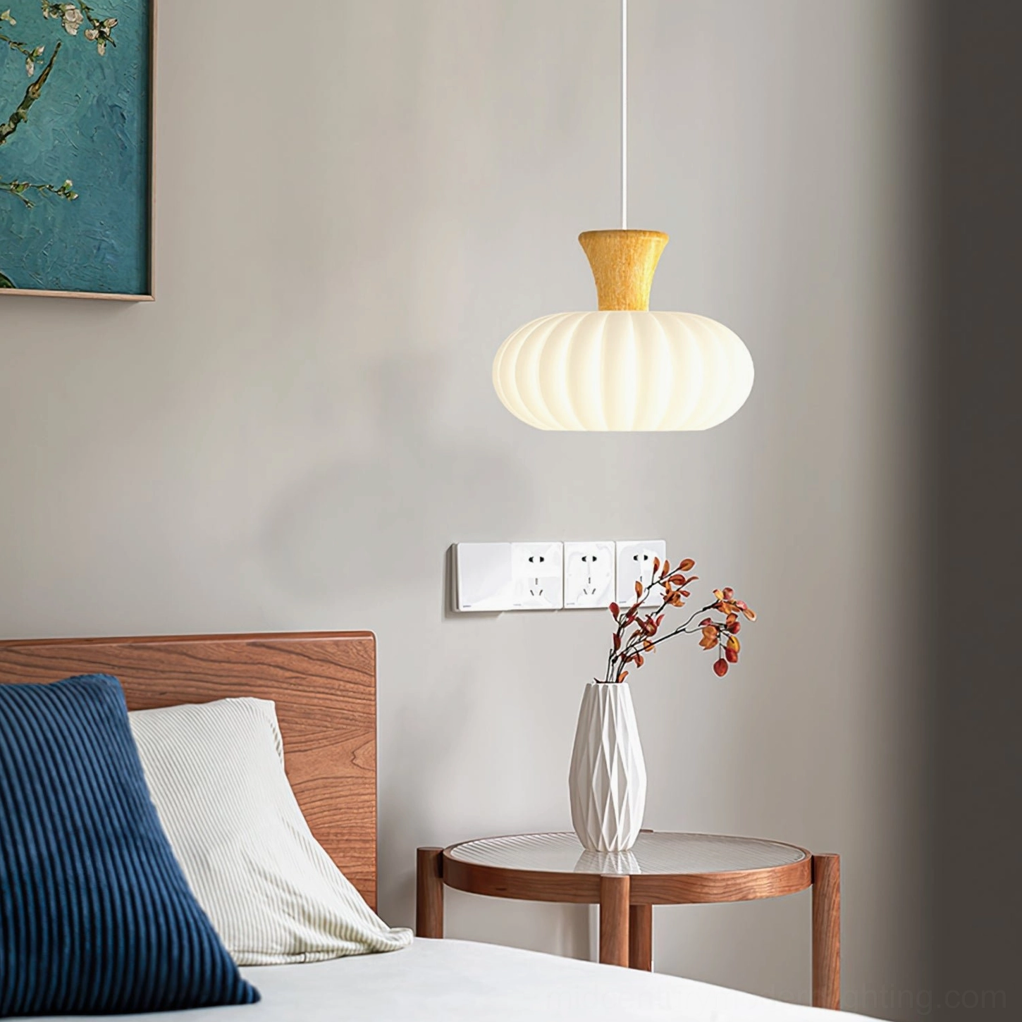 Cylindrical ribbed glass pendant displayed in minimalist bedroom bedside area