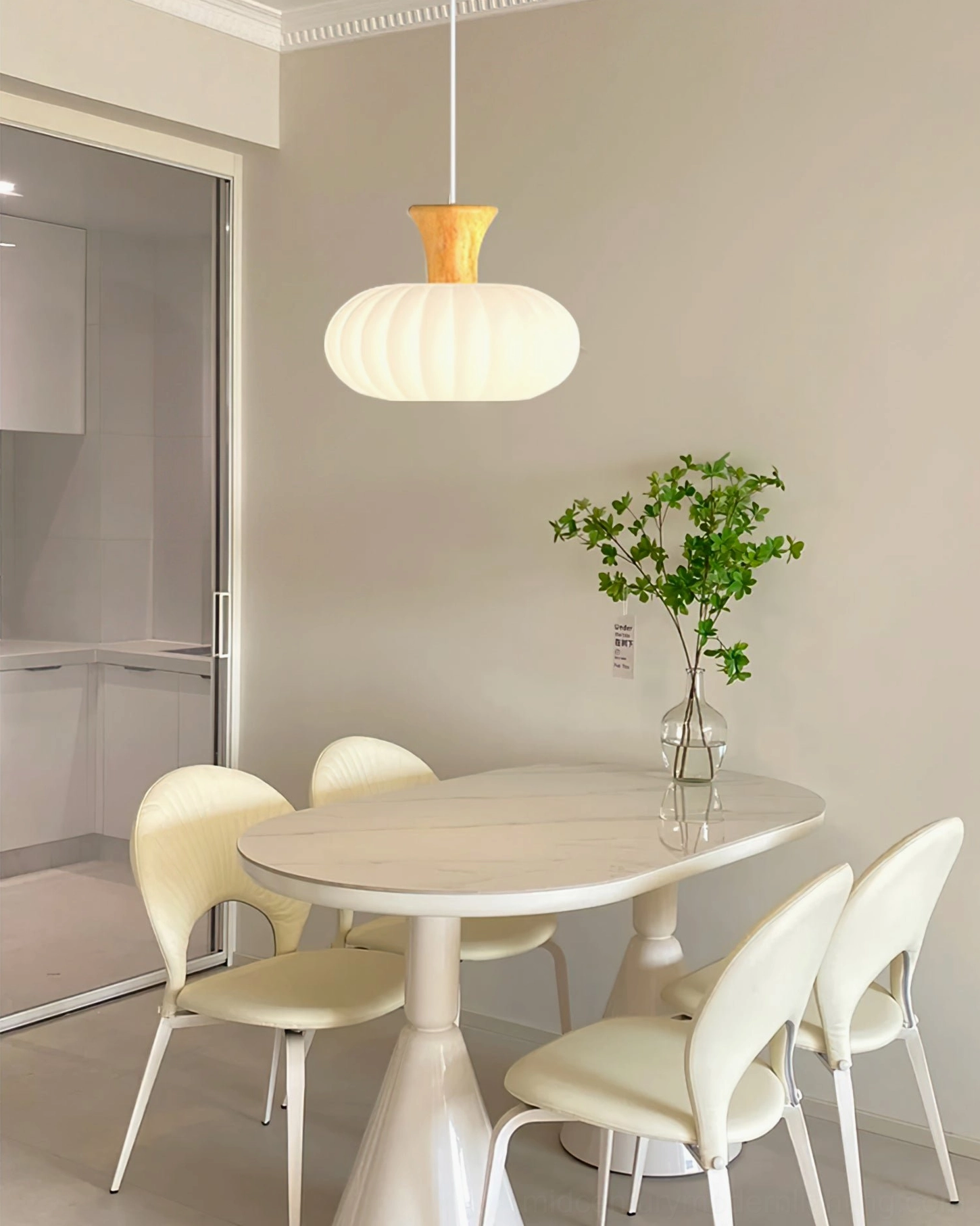 Gourd ribbed pendant in neutral interior showing soft diffused light through fluted glass