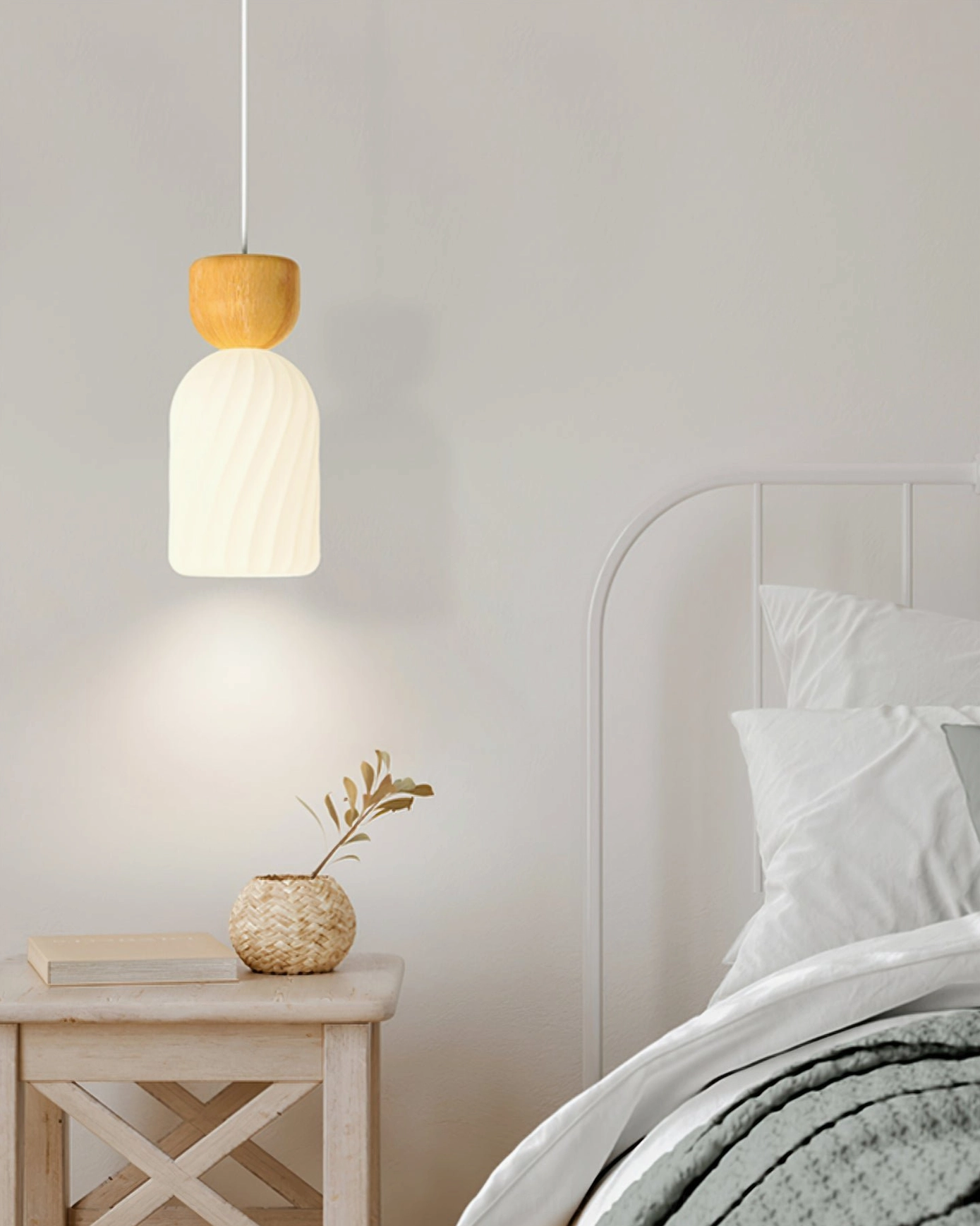Mid-century modern ribbed glass pendant in minimalist bedroom with metal bed frame