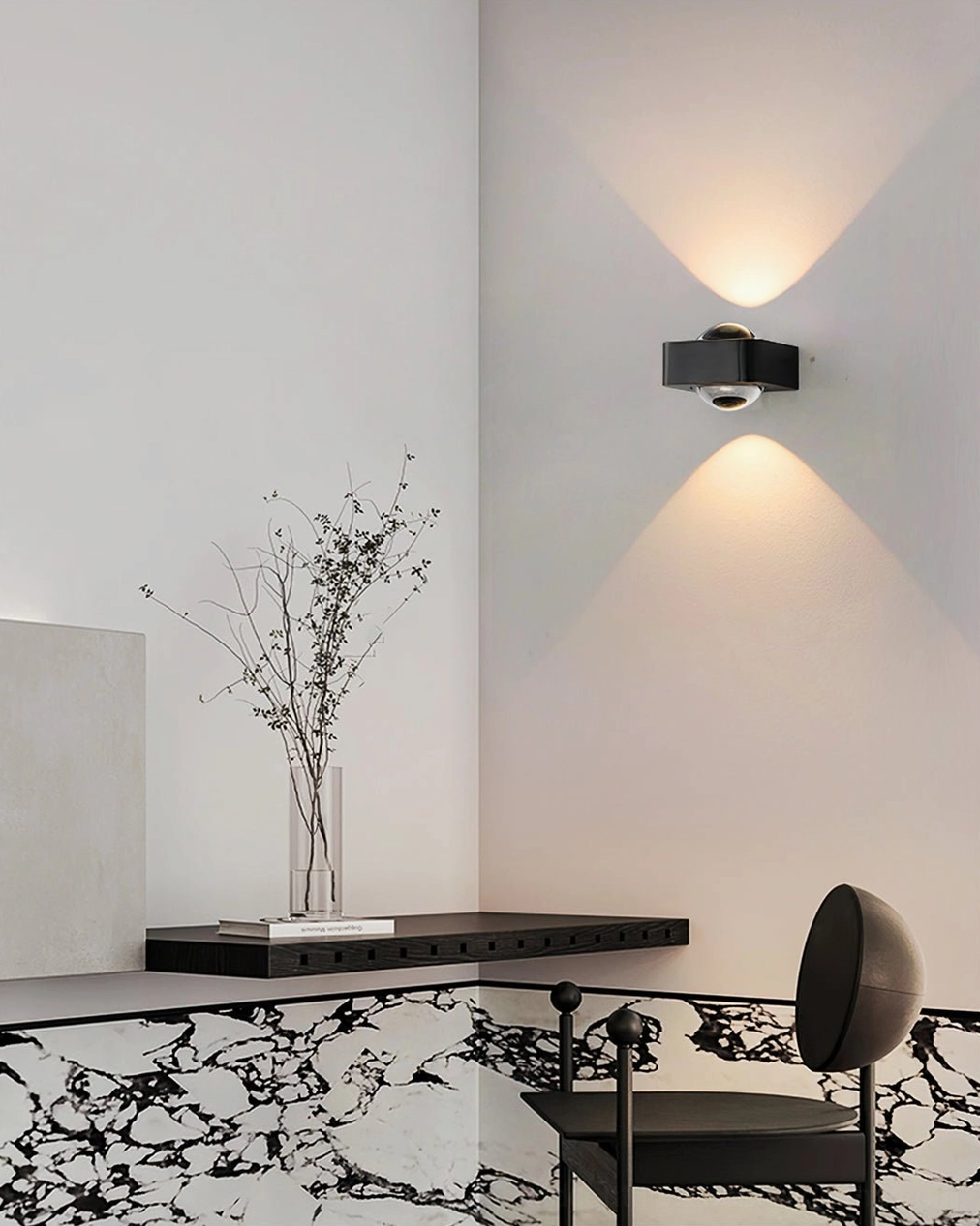 Black Grace modern wall sconce installed in contemporary study and marble dining area