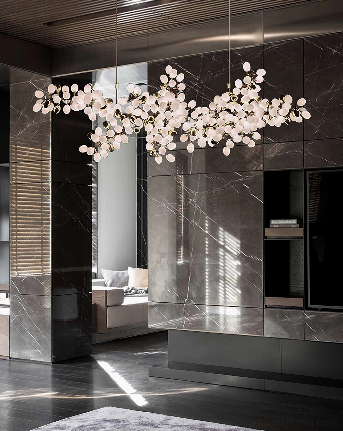 Grape vine cluster chandelier detail showing individual frosted glass bulbs and brass metal vine structure