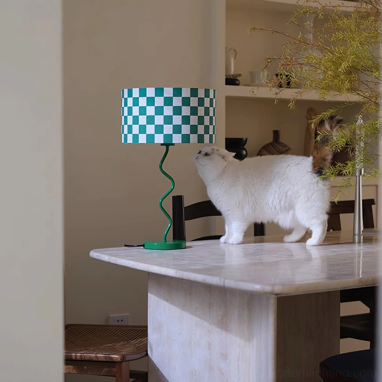 Modern checkered lamp with cat beside it on marble countertop interior styling
