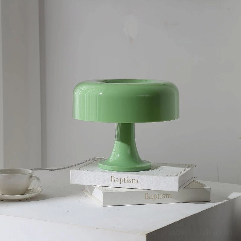 Green mushroom table lamp close-up showing translucent acrylic shade and internal glow-from-within effect