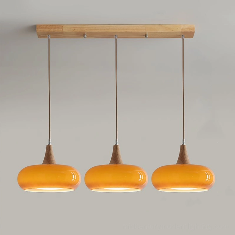 Three-head Hailie pendant lamp orange amber glass finish linear configuration