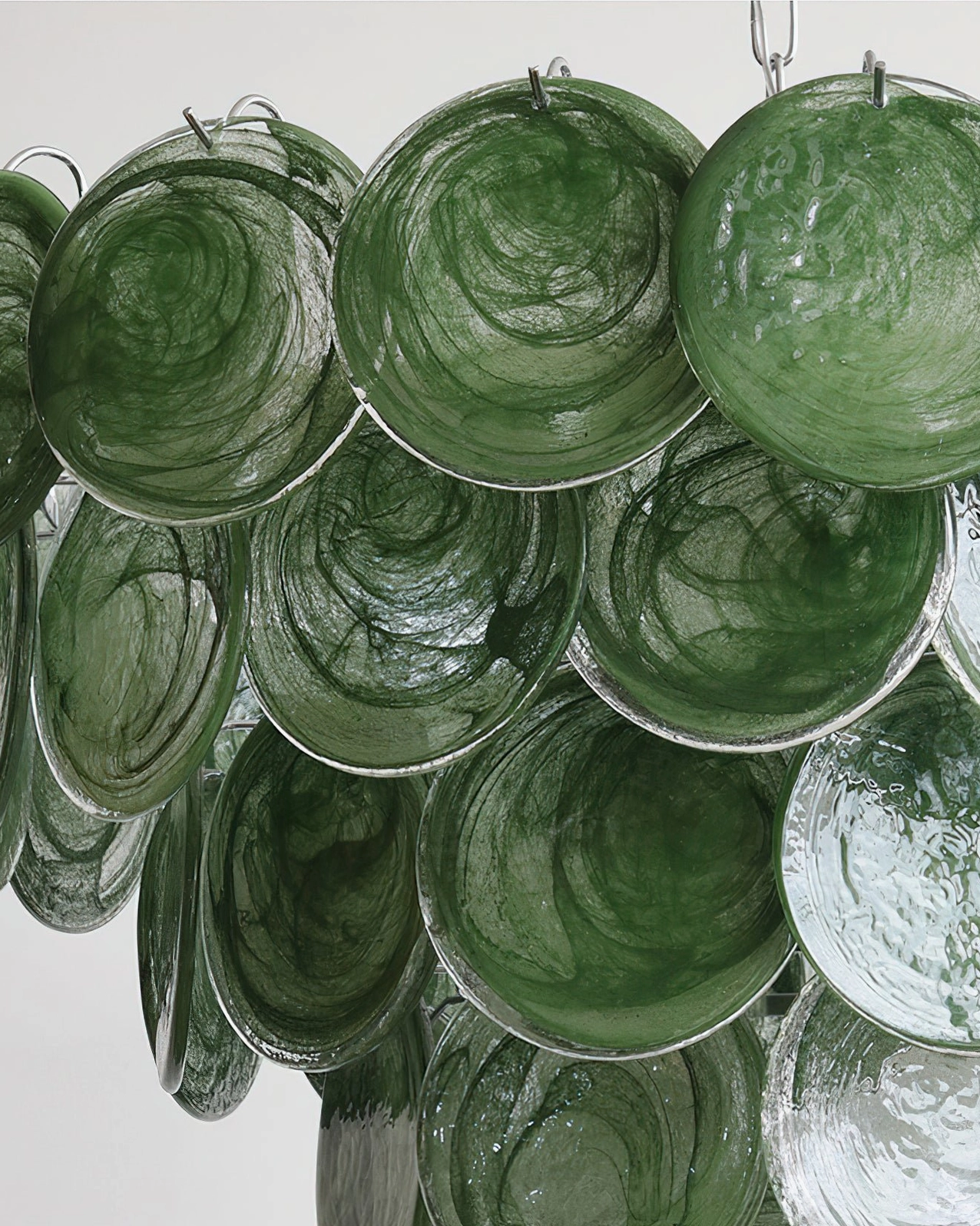 Detailed close-up of individual hand-pressed glass discs showing artisan craftsmanship and ripple patterns
