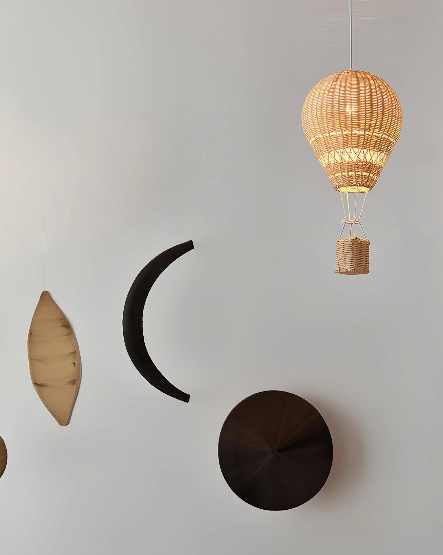 Artisanal handcrafted rattan hot air balloon pendant light fixture showing organic weave