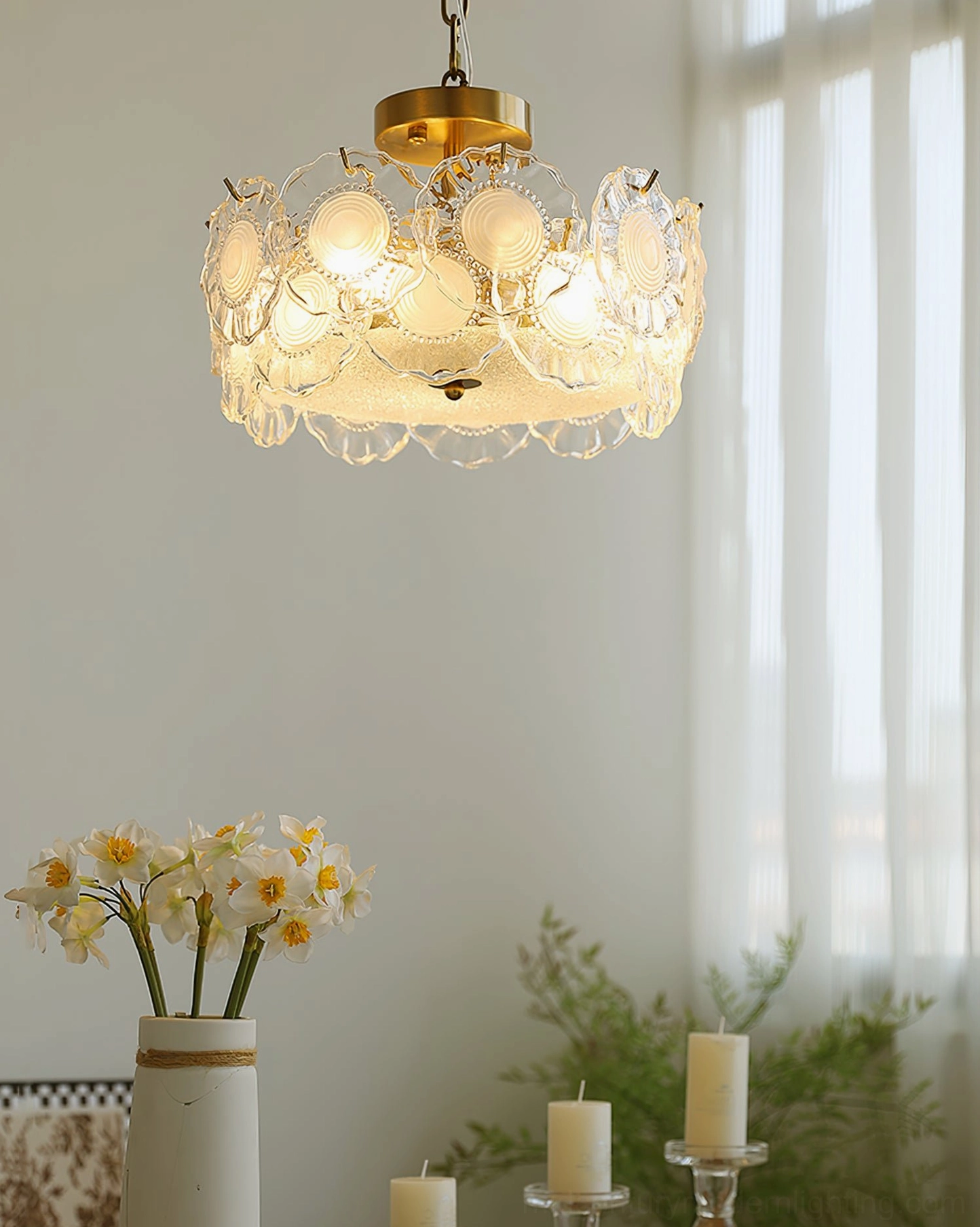 Hanging glass ceiling lamp in bright home interior with sheer curtains and floral accents creating warm glow