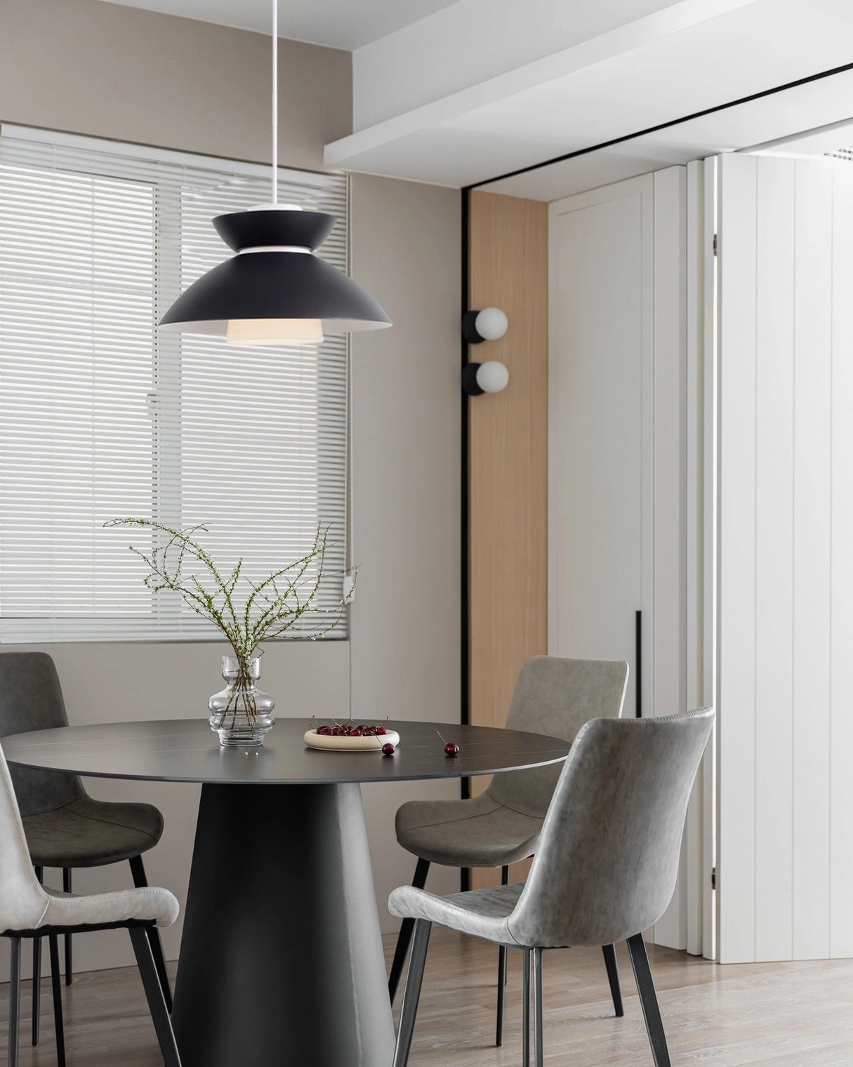 Hannes geometric pendant lamp showing detailed layered shade construction and warm LED illumination