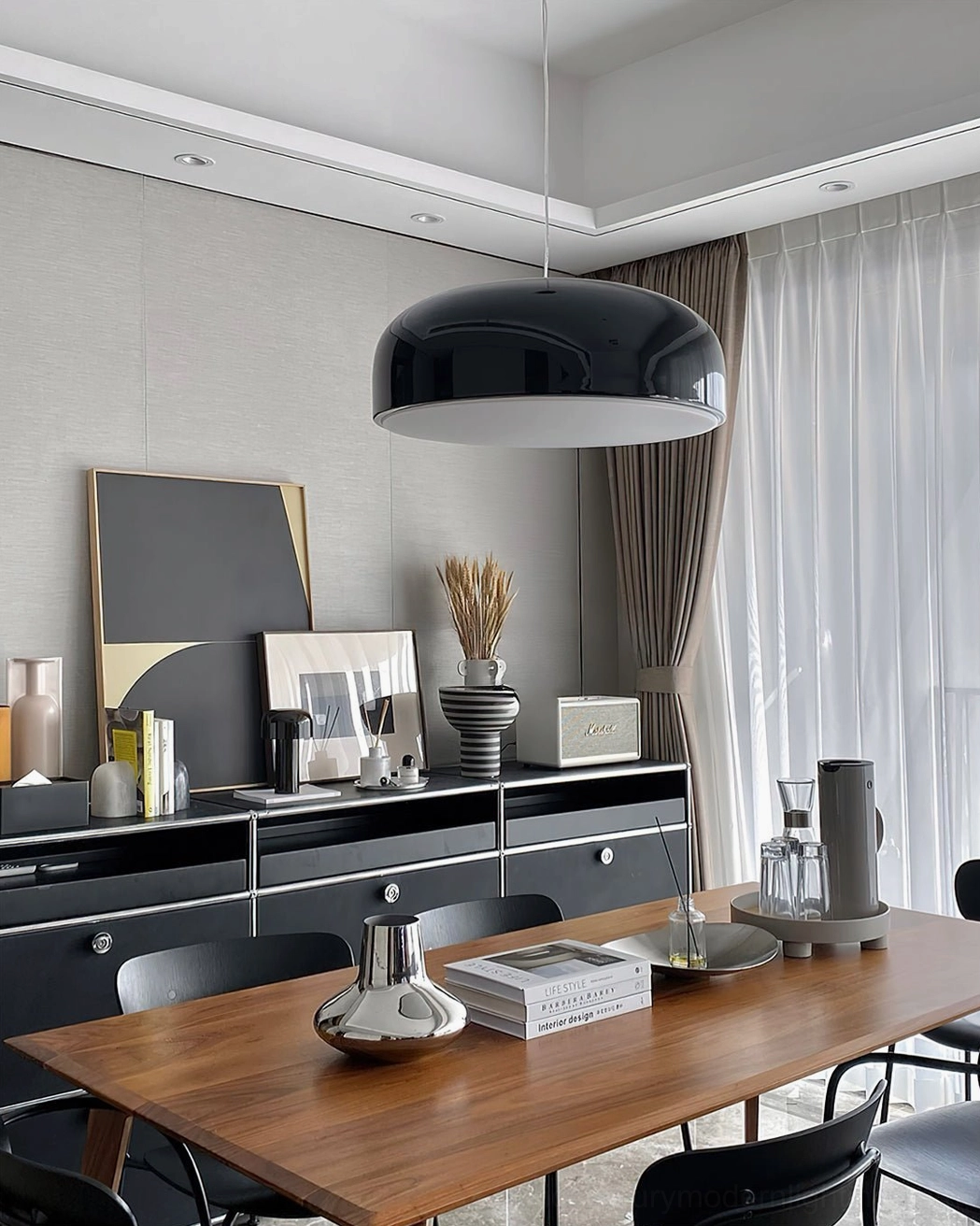 Black Harper dome pendant in modern minimalist luxury dining room, adjacent table perspective showcasing refined contemporary pendant lighting