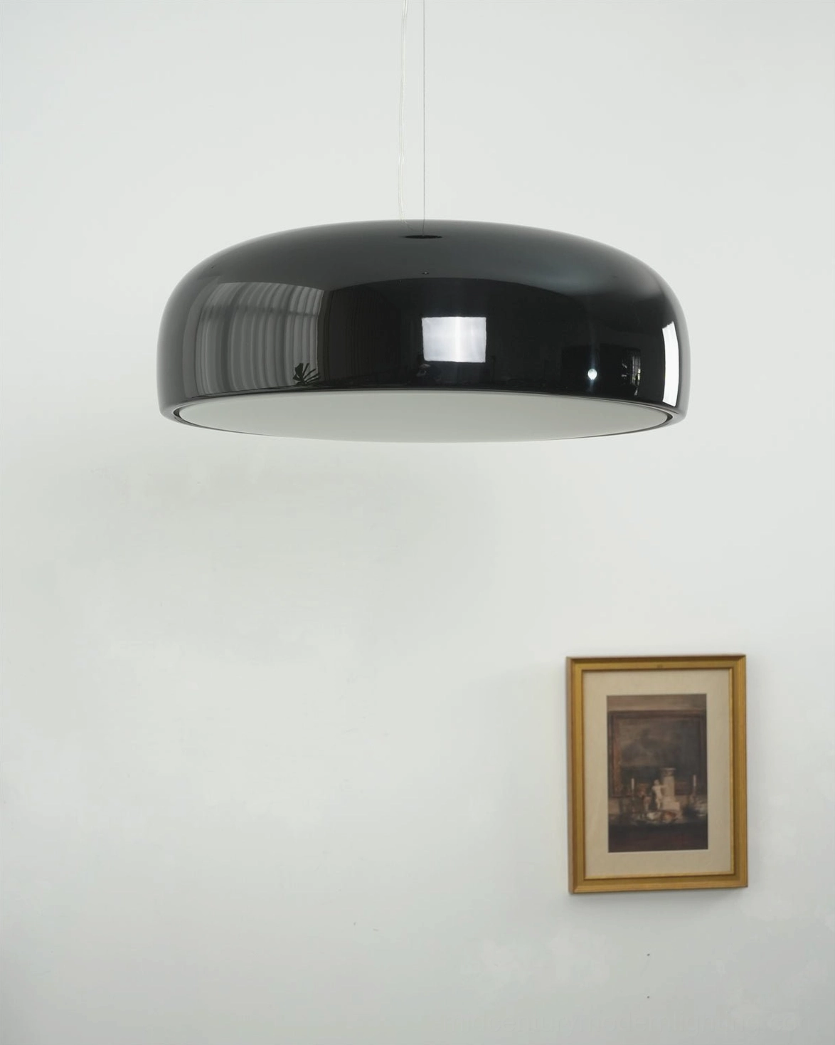 Harper pendant light suspended in modern living space, full room context showing how dome fixture integrates with contemporary decor