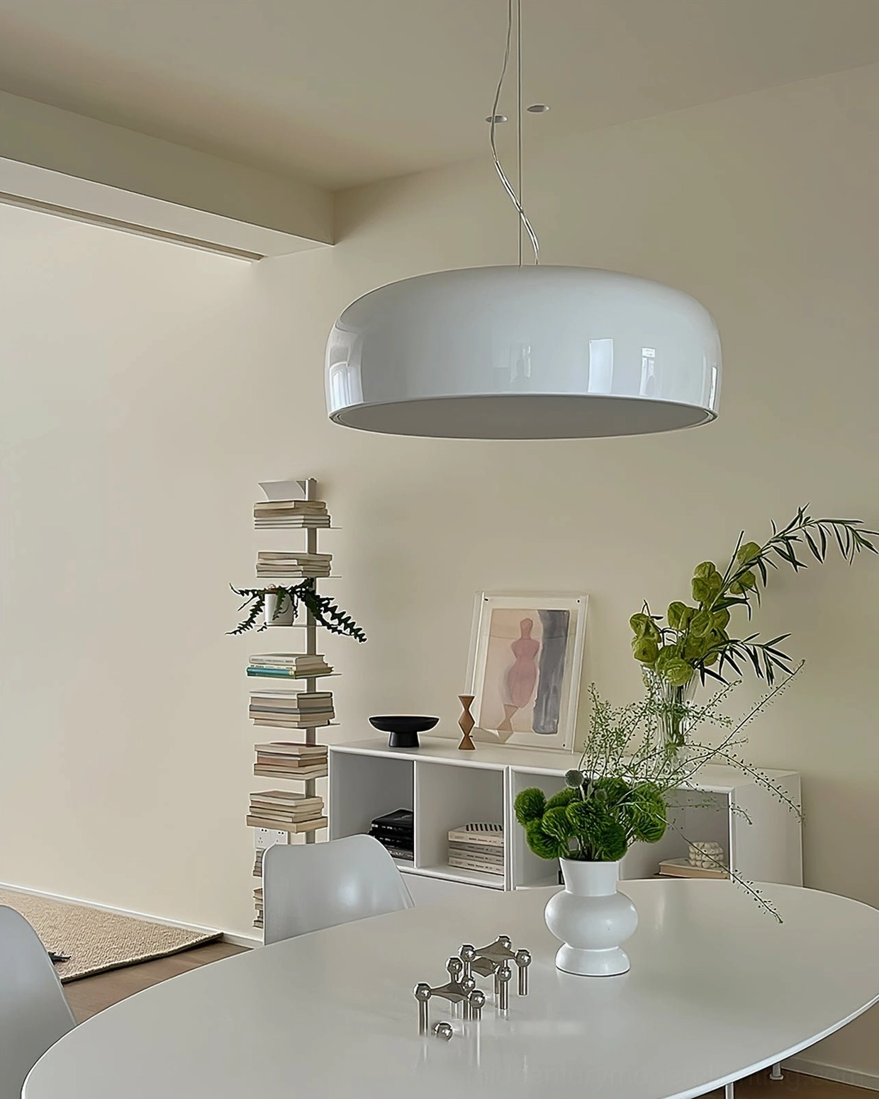 Clean white Harper pendant light in Nordic dining room with warm decor, eye-level frontal view of contemporary dome pendant design