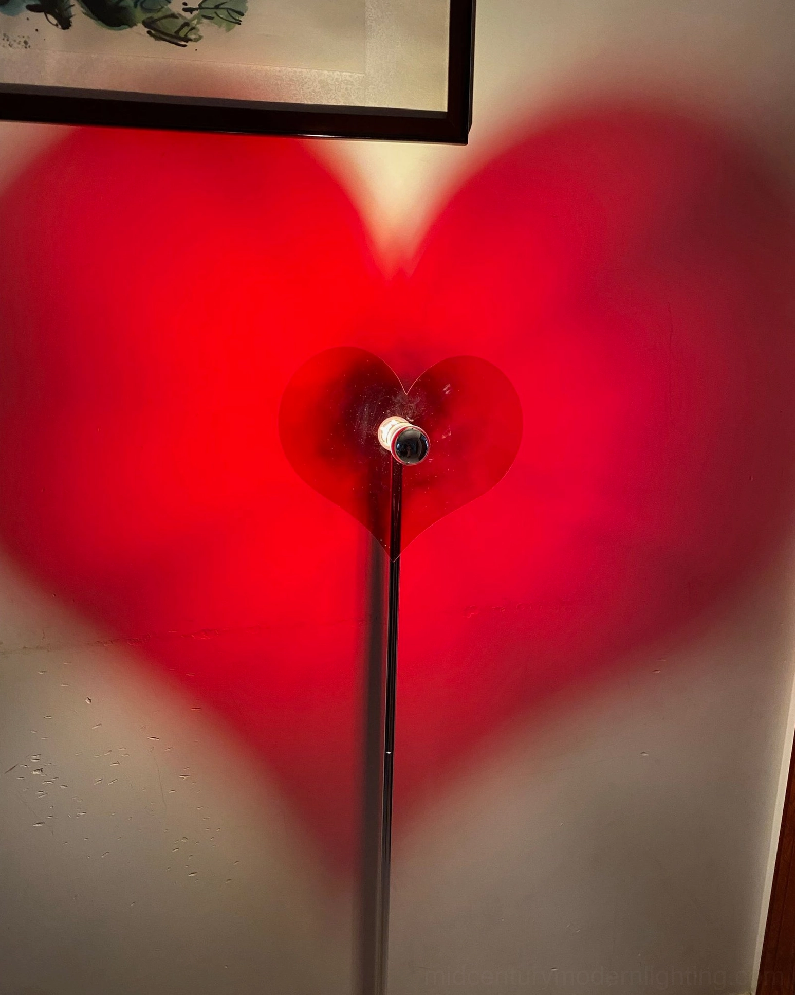 Heart projection floor lamp creating emotional ambiance in modern home interior setting