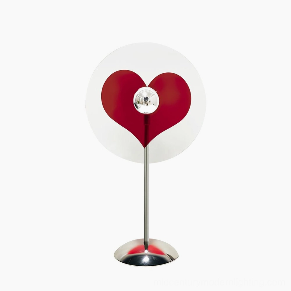 Heart-shaped projection lamp in chrome, red, and clear finish options for diverse interior coordination