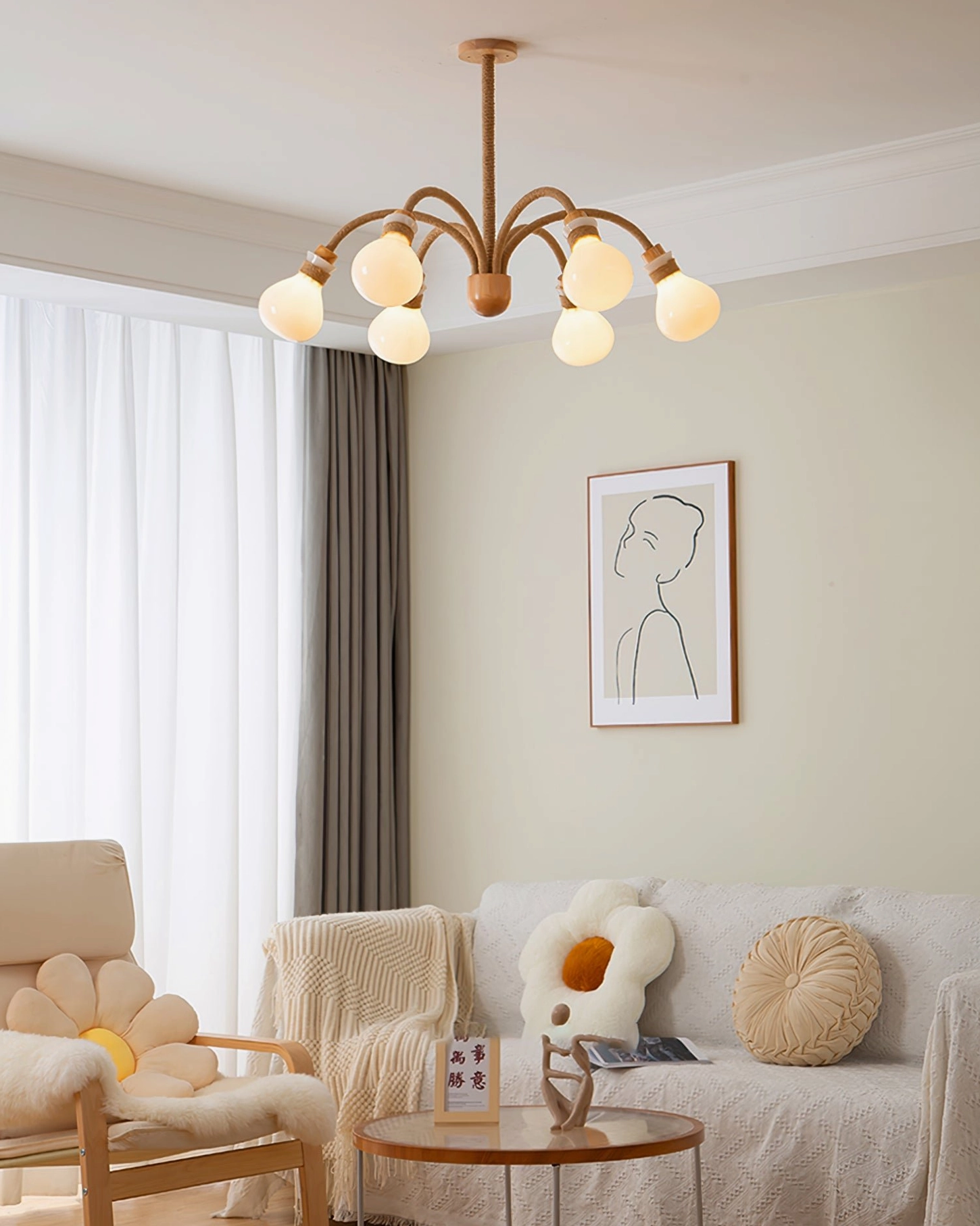 Side view of multi-light wooden rope chandelier with rope-wrapped arms in cozy farmhouse living room setting