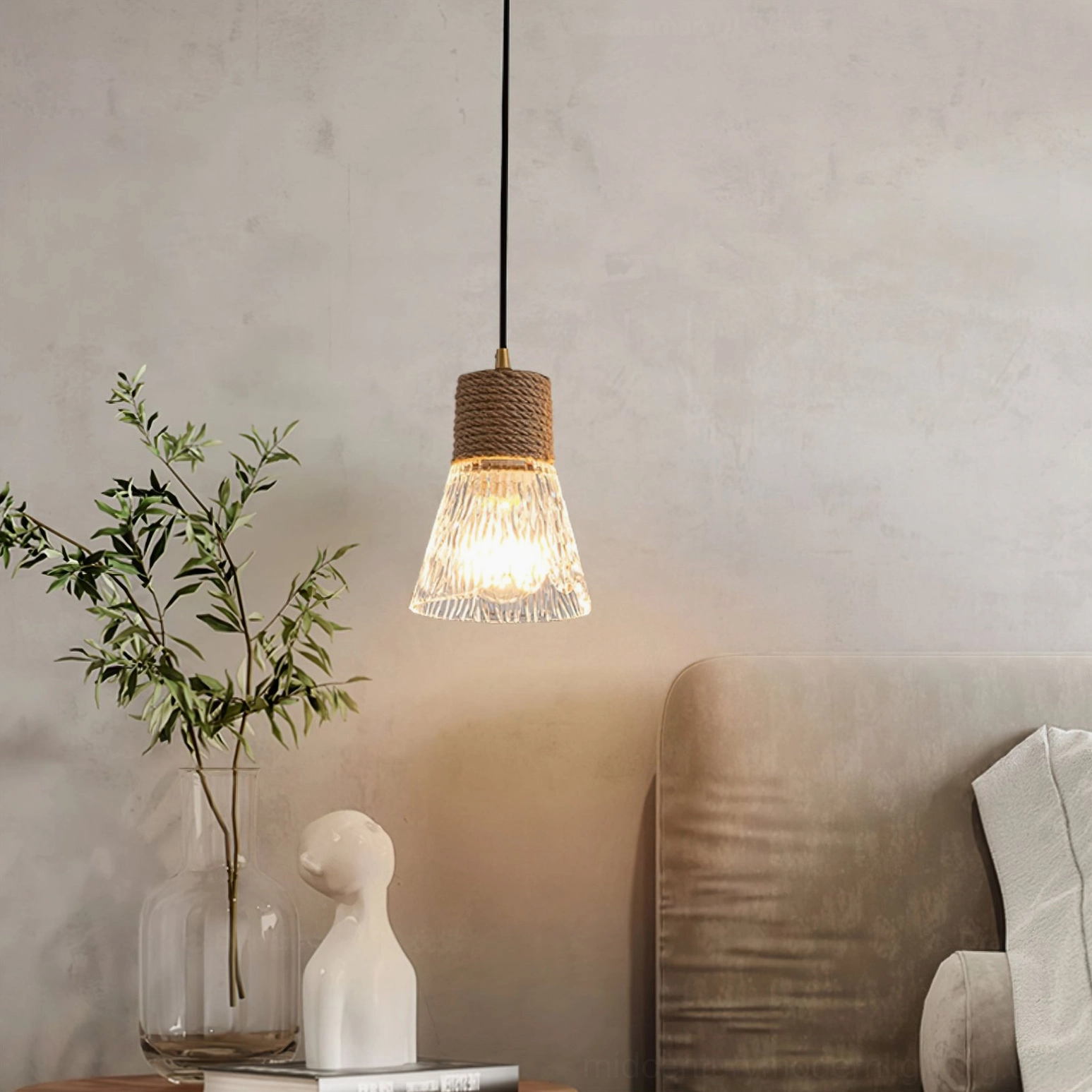 Hemp rope glass pendant light in close-up detail, showing rope texture and glass frosting for warm illumination