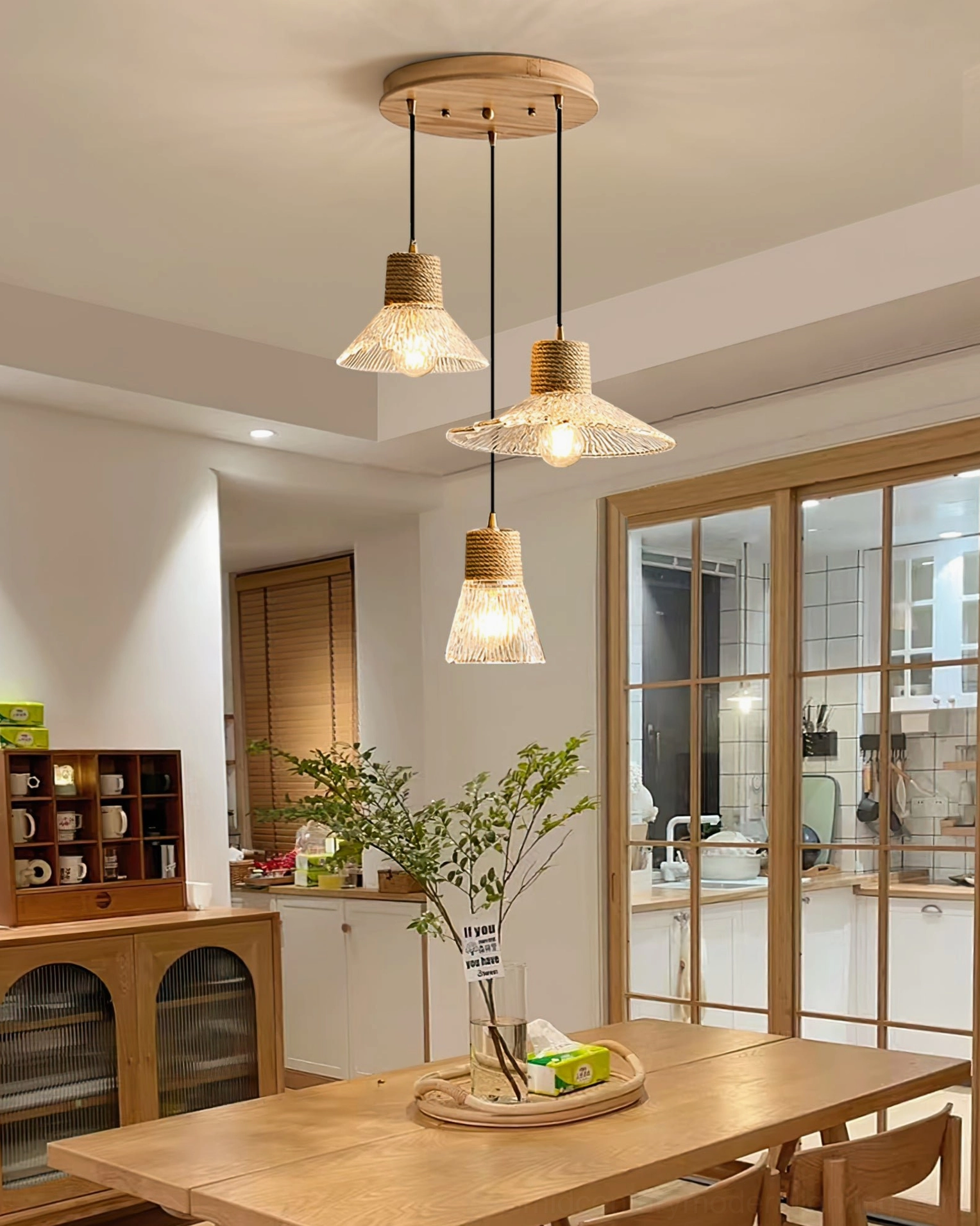 Hemp rope glass pendant light in transitional interior space, soft frosted glass diffusion and natural material warmth