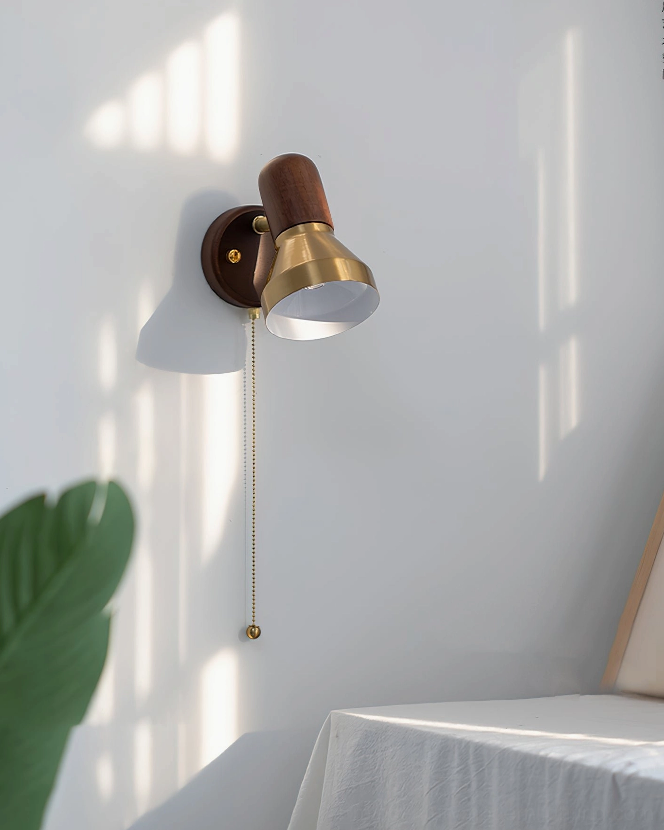 Bedroom application of Heron wall sconce as bedside reading light with ambient warm glow
