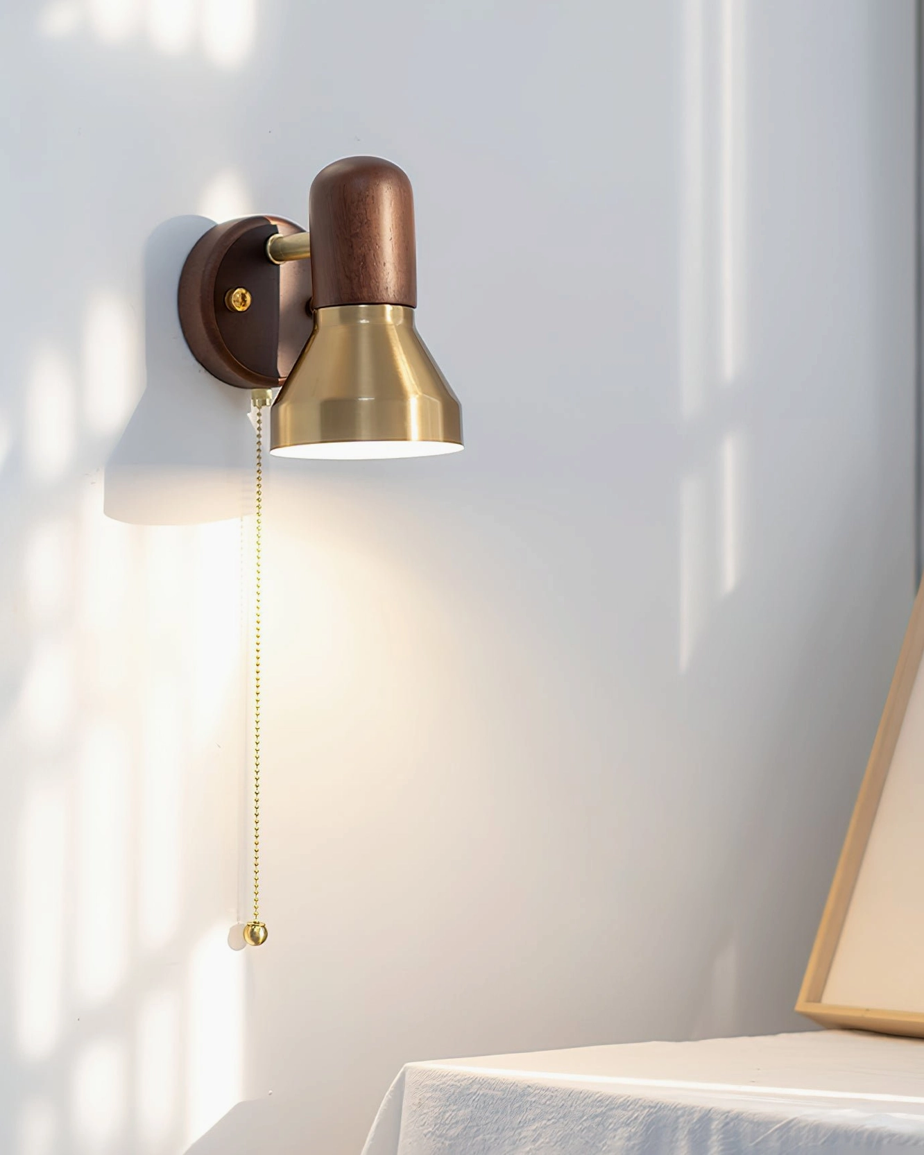 Mid-century modern Heron wall sconce in home interior with minimalist decor and furniture