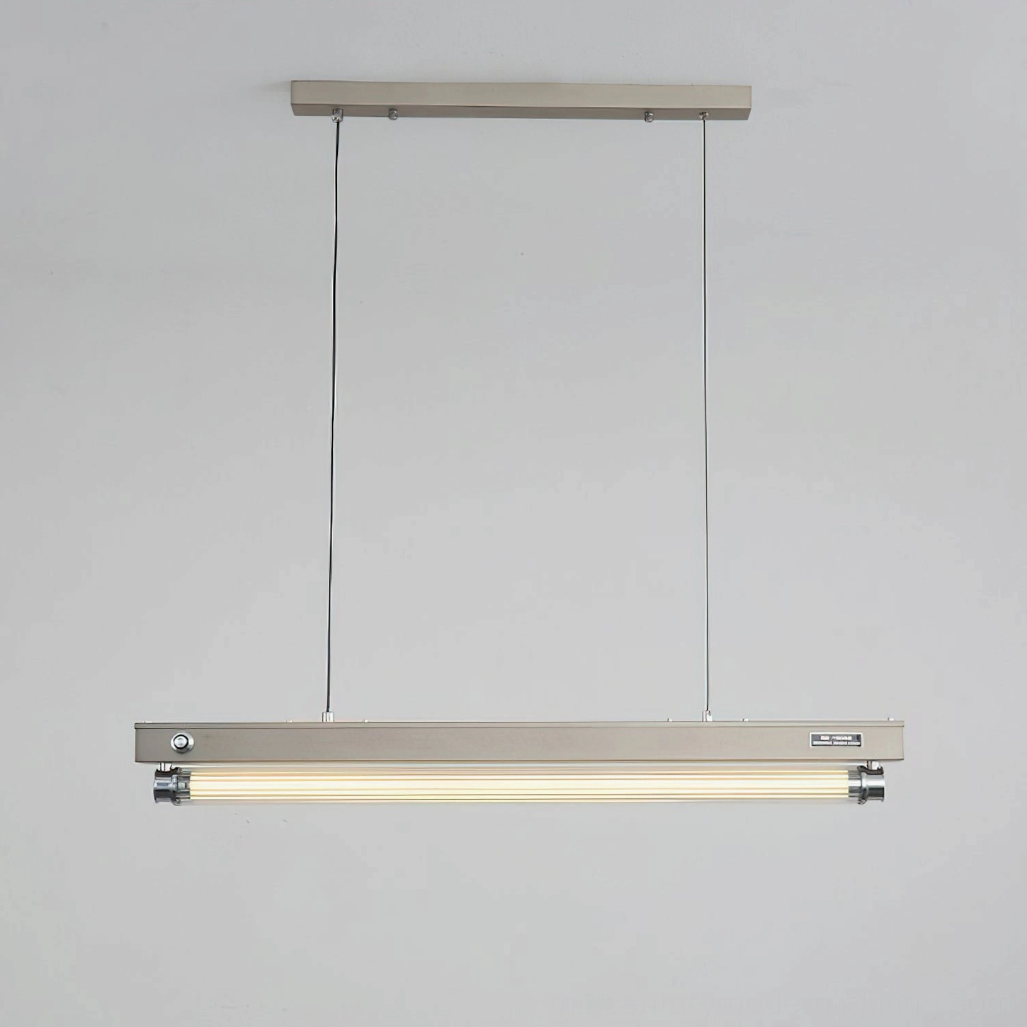 Full view of Hiromi linear pendant light mounted to ceiling with minimal aesthetic design
